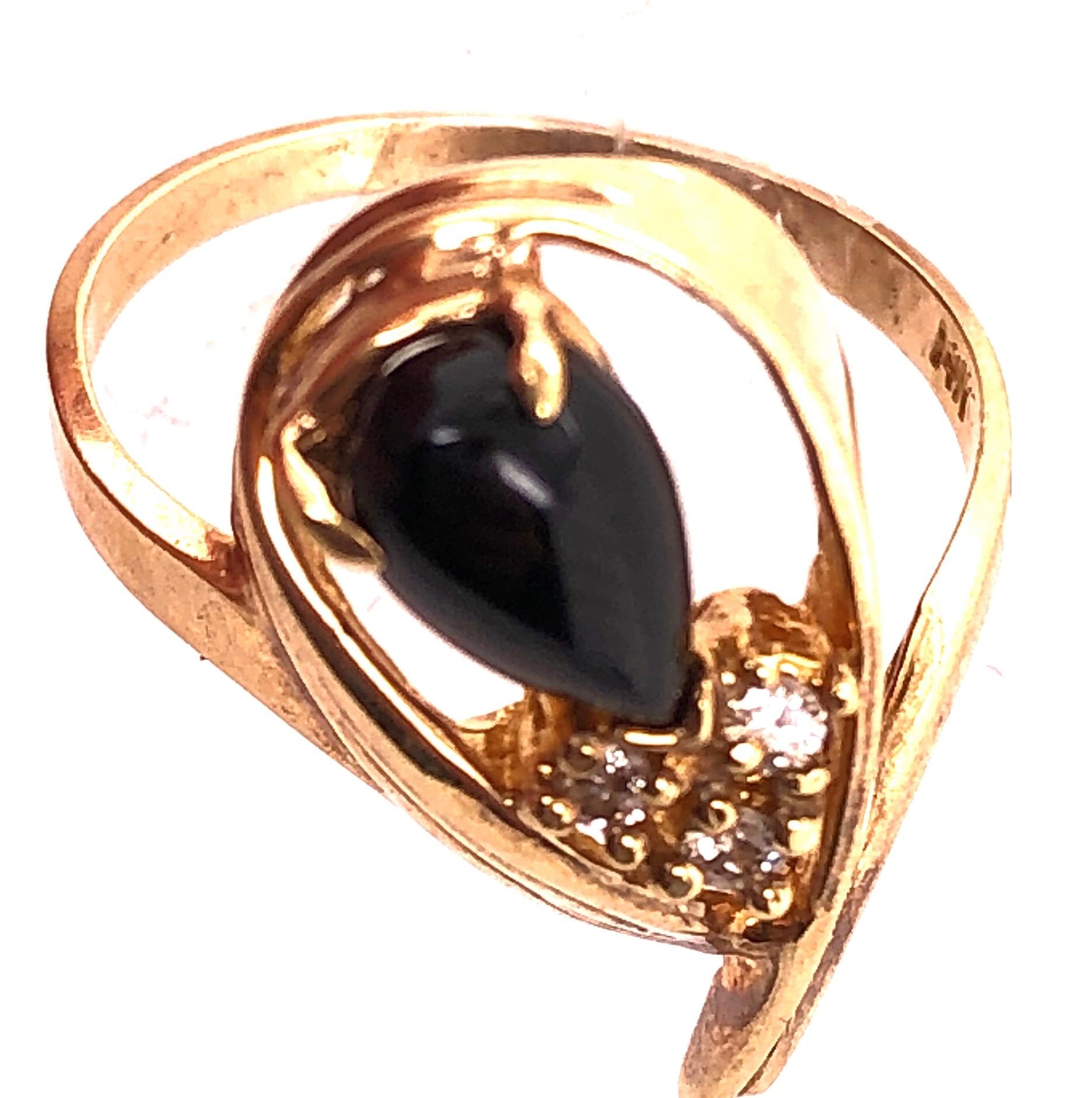 Pear Cut 14 Karat Onyx and Diamond Yellow Gold Ring Freeform 0.03 TDW For Sale