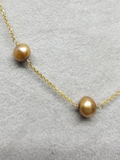 Collana "Perla e catena" a 14 carati con perle d'acqua dolce dorate