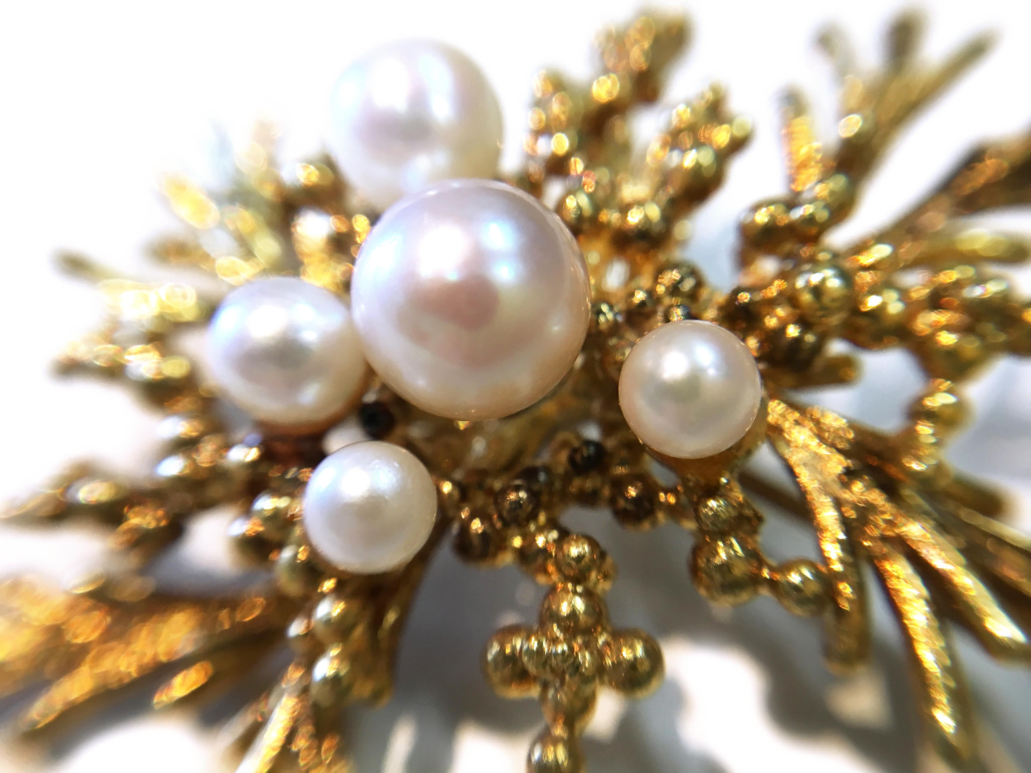 14 Karat Pearl Branches Brooch. Five Freshwater Pearls in graduated sizes ranging from 1.36mm-2.25mm adorn the center of this branch and berries brooch. Stamped on the back of the brooch is 585 A*D. The brooch/pin has a gold weight of 10.5 grams. 