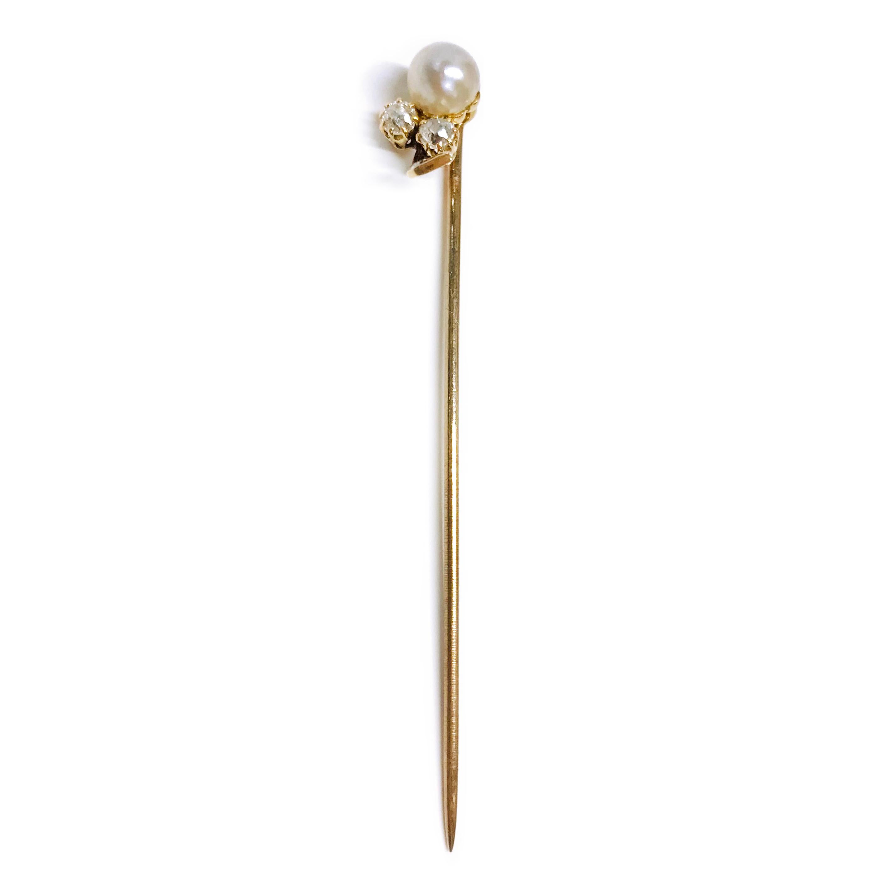 14 Karat Pearl Diamond Hat Pin. This lovely pin features a 6mm round pearl, two 3mm round brilliant-cut prong-set diamonds, and one small round bead-set accent diamond. The total carat weight of the diamonds is 0.20ctw. A simply elegant piece with a