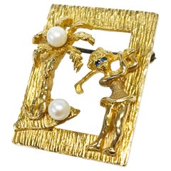 Broche/pièce de golfeur en perles et saphirs 14 carats