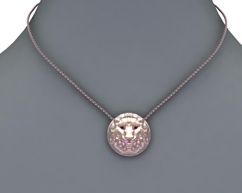 14k Pink Gold Lion Pendant with Ruby Eyes,  Matte finish, 21 mm diameter x 5.4 high on a 18 inch chain 1.5 mm wide.  1.5 mm ruby  eyes .This chain is for women too short and fine for men. This is tumblewith steel pins  finished so as not to lose