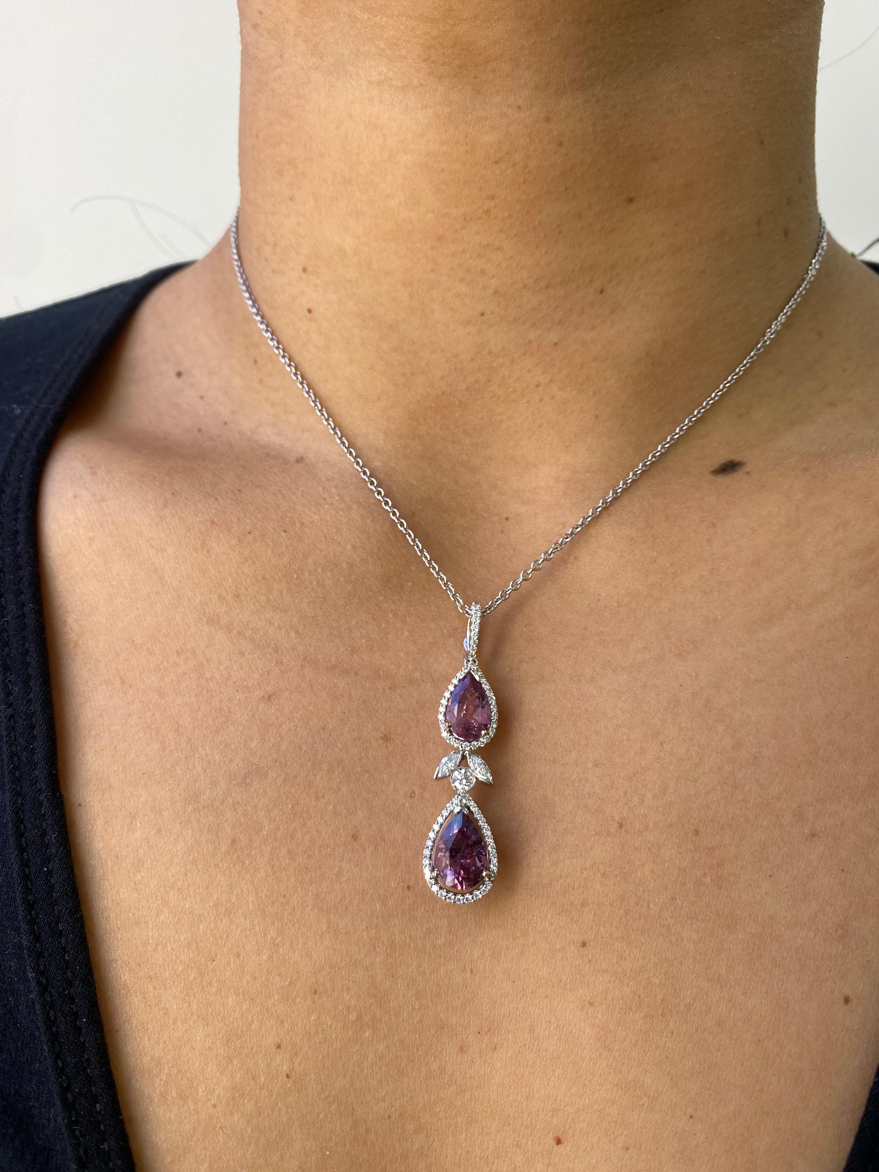 14 Karat Pink Tourmaline Necklace with Diamonds 

This pretty in pink necklace features to natural Brazilian pear shaped pink tourmalines surrounded with round brilliant natural diamonds. In its center, are 2 marquise eye-shaped diamonds, with a