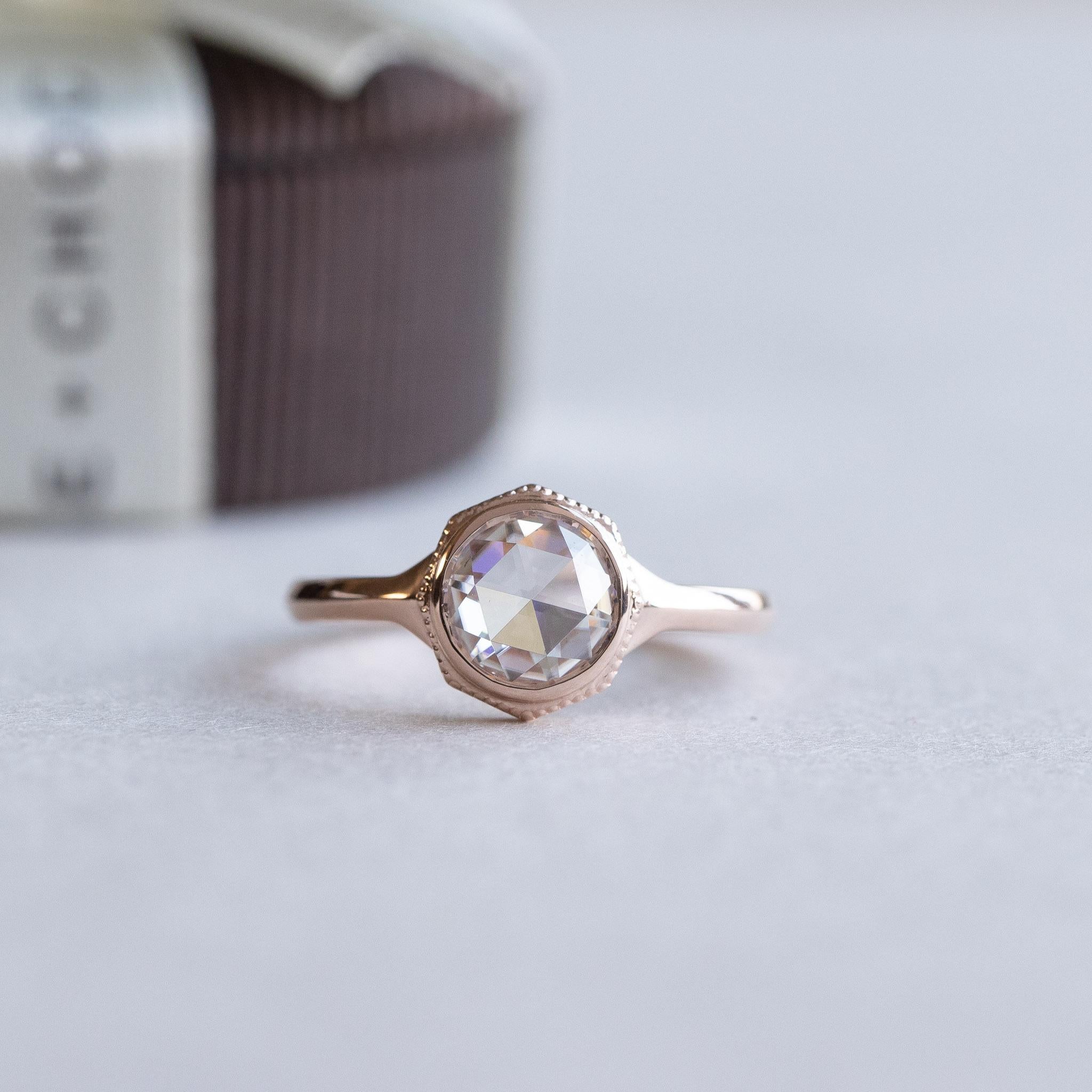 Low profile rose cut diamond set on 14k rose gold
Approx .75 carat Diamond
Stone: 6.5mm
Clarity: VS/SI1
Color: GHI
Cut: Rose cut
1.4mm band width.
Rose gold, white gold, yellow gold available

