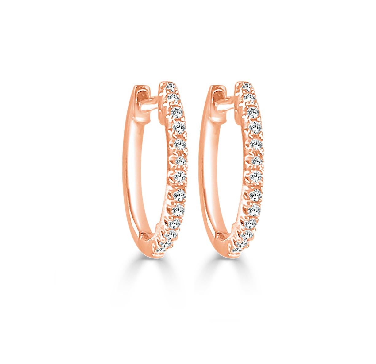 Simple yet stunning, these Diamond huggie hoops are crafted from 14k gold with glittering white 0.09 ct. of diamonds. Each delicate U-shaped hoop features a single line of white diamonds, pave-set across the face in a gorgeous display. 1/2