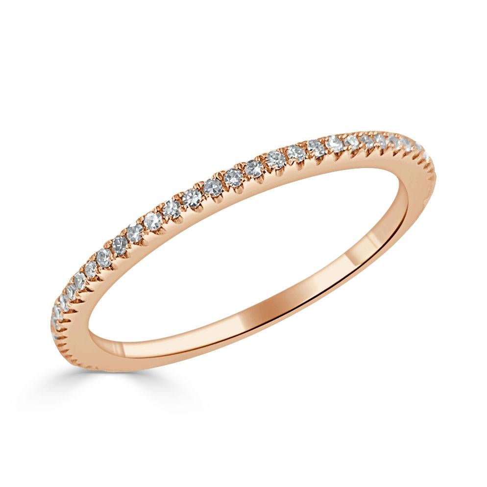 This ring is a must-have for every woman's jewelry wardrobe. It is a delicate beautiful and sparkly diamond stackable eternity. This simple, elegant piece features a 14-karat gold construction with 18 points of round-cut sparkling white diamonds