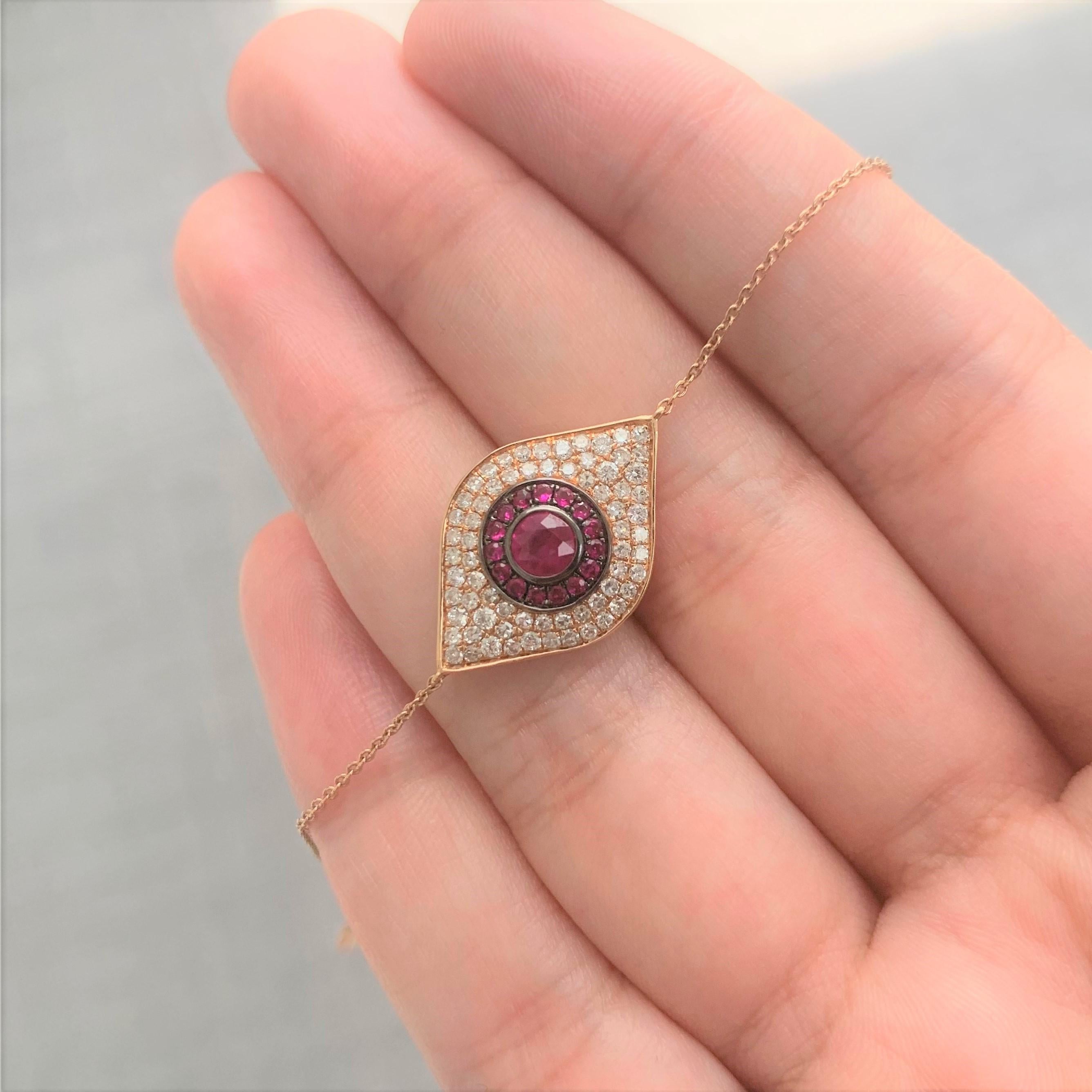 Show off your unique style with this striking Evil Eye Bracelet . This bracelet is crafted of 14k gold and features approximately 0.37 ct of genuine white diamonds and 0.45 ct of Rubies. Diamond color and Clarity GH SI1-SI2. Adjustable to