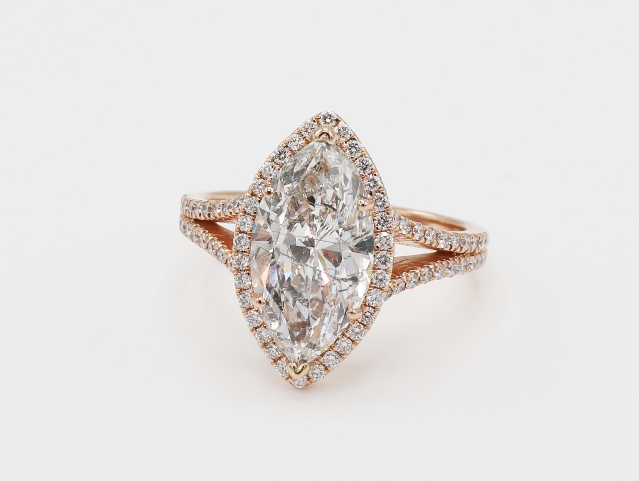 14 Karat Rose Gold 3.02 Carat Marquise Diamond Halo Engagement Ring Size 6.25
Metal: 14k rose gold
Weight: 3.72 grams
Diamond: Marquise, 3.02 carat. Approx. I I1
Accent diamonds: Approx. .45 CTW G VS
Dimensions: 17 x 9.7MM
Size: 6.25 (US)

