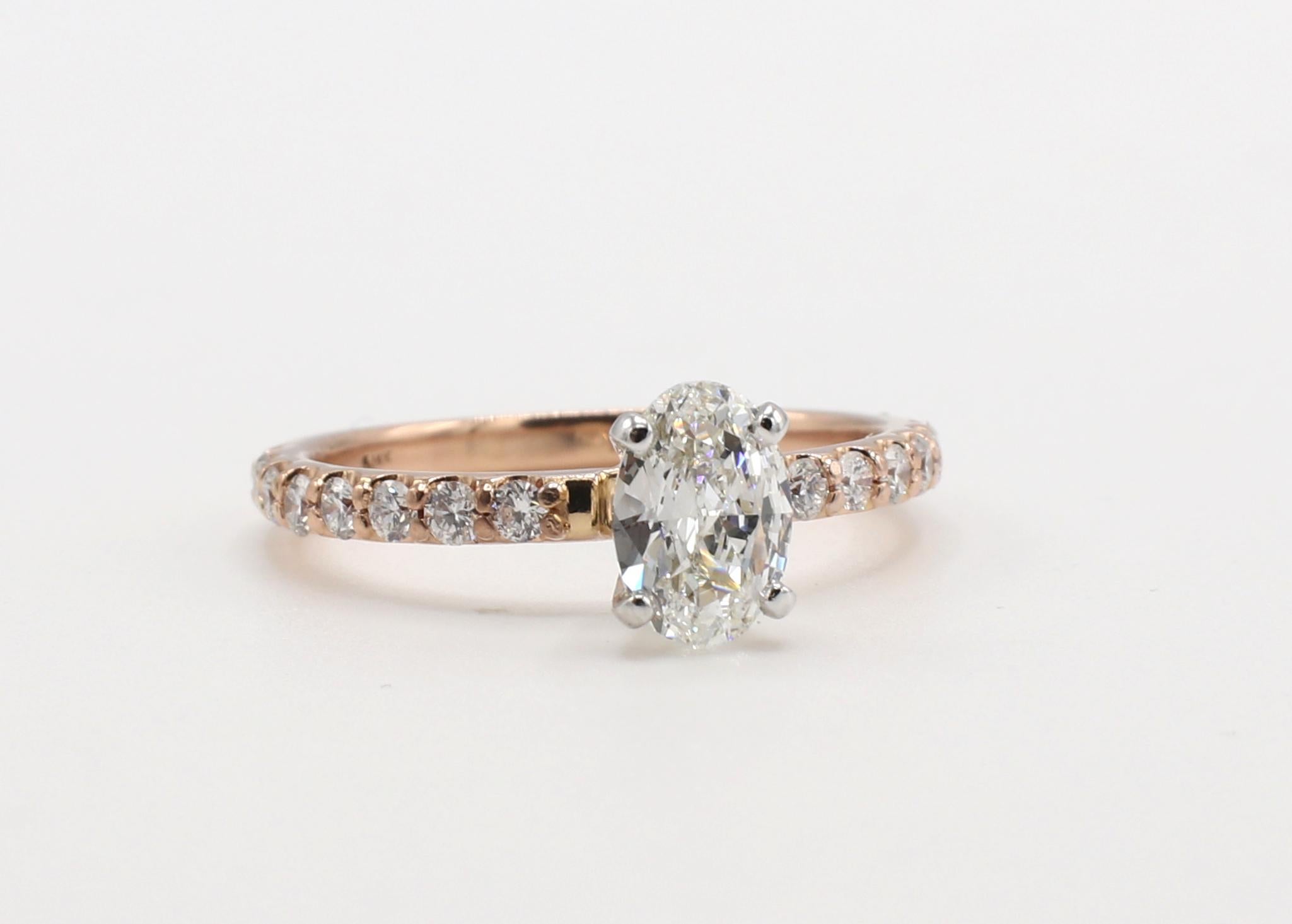 14 Karat Rose Gold .55 Carat Oval Natural Diamond Engagement Ring 
Metal: 14k rose gold
Weight: 1.86 grams
Diamond: Approx. .55 carat oval H VS natural diamond
Accent diamonds: Approx. .32 CTW G VS natural diamonds
Size: 5.5 (US)
Height: 6mm
Band: