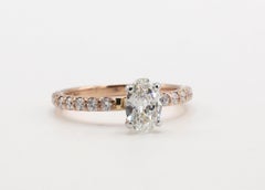 14 Karat Rose Gold .55 Carat Oval Natural Diamond Engagement Ring