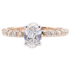 14 Karat Rose Gold .55 Carat Oval Natural Diamond Engagement Ring