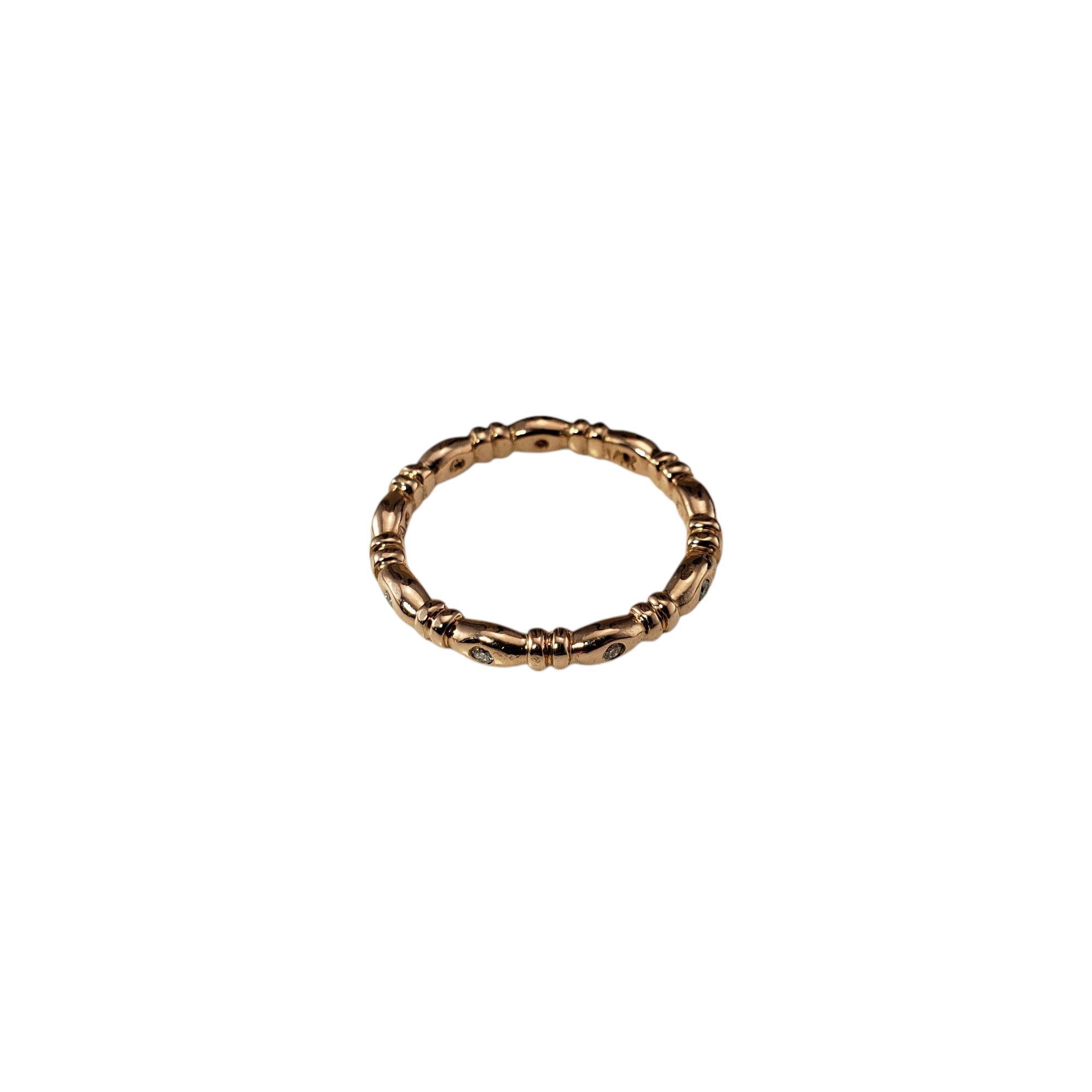 14 Karat Rose Gold and Diamond Band Ring Size 6

This dainty band features nine round brilliant cut diamonds set in beautifully detailed 14K rose gold. 

Width: 2.5 mm.

Approximate total diamond weight: .09 ct.

Diamond color: G-H

Diamond clarity: