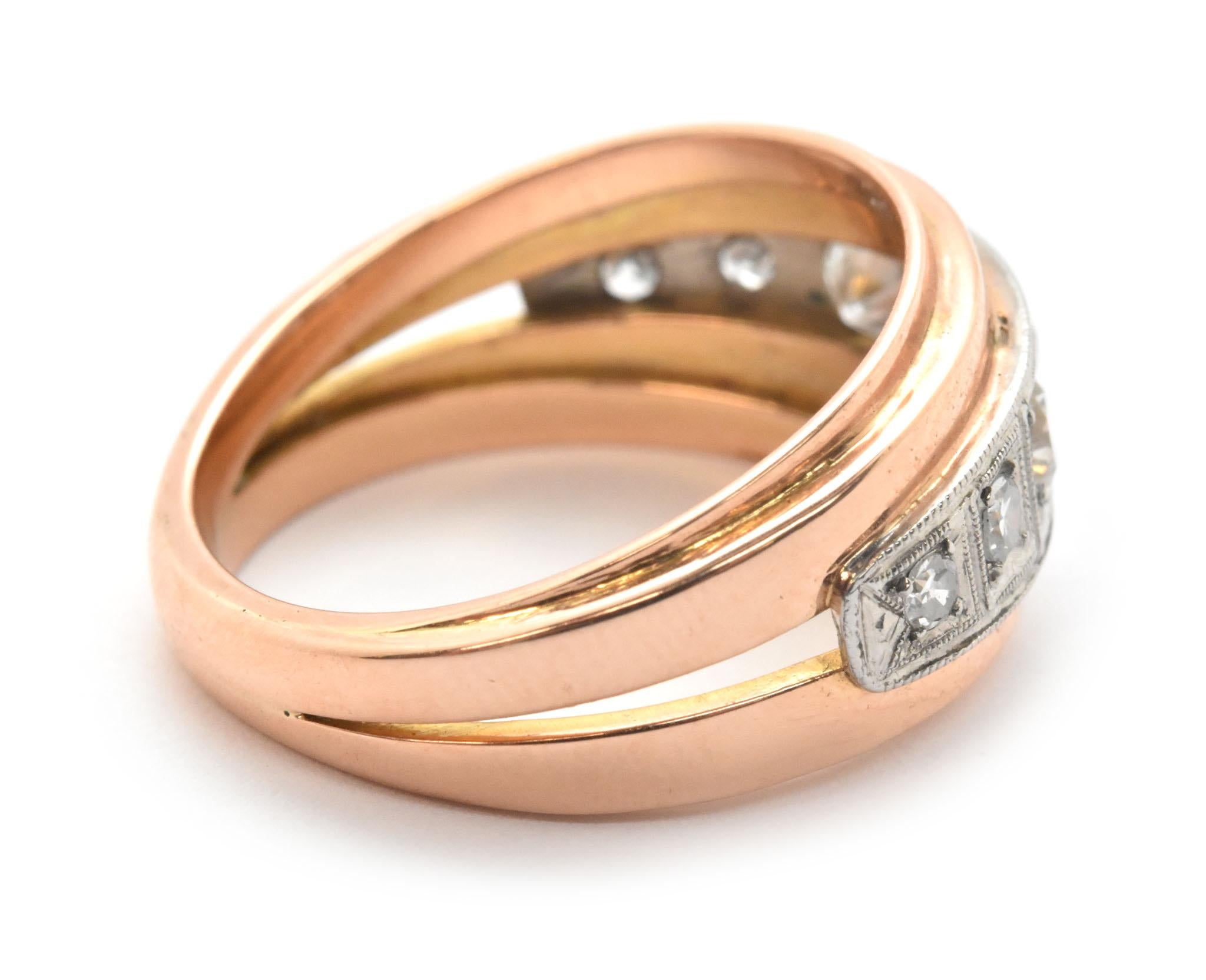 This fashion band is crafted in 14k rose gold. The band is invisible-set with round European-cut diamonds. There are seven diamonds that weigh a total of 0.62ct. The diamonds are graded F-G in color and VS in clarity. The band measures 12mm at its