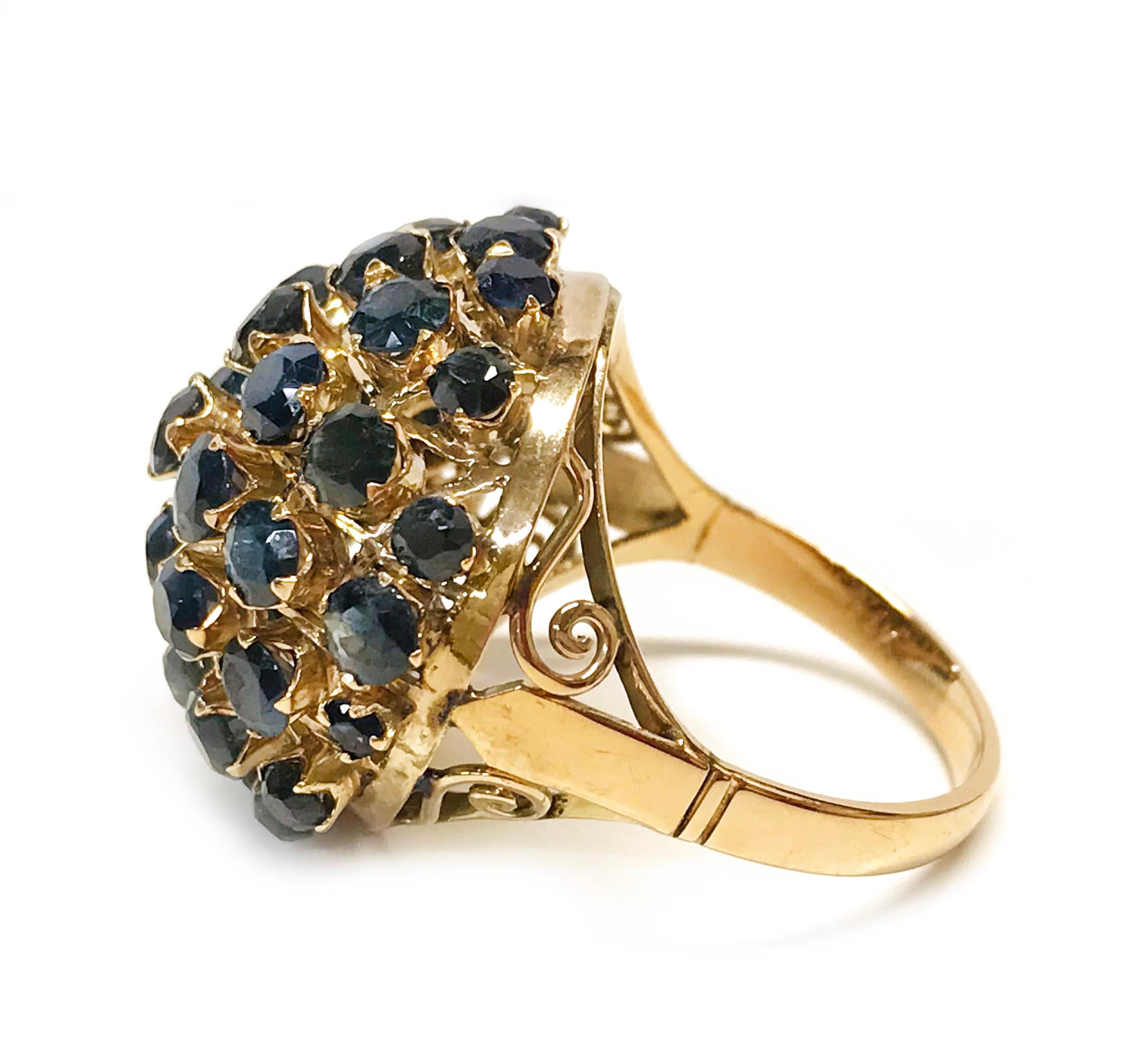 14 Karat Rose Gold Natural Blue Sapphire Dome Ring. A beautiful dome design with thirty-seven graduate prong-set round dark blue sapphires. The sapphire's total carat weight sapphires are 3.70ctw. The sides of the band have a scroll detail adding