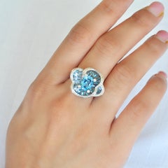 14 Karat Rose Gold Blue Topaz Special Cut Flower Contemporary Cocktail Ring