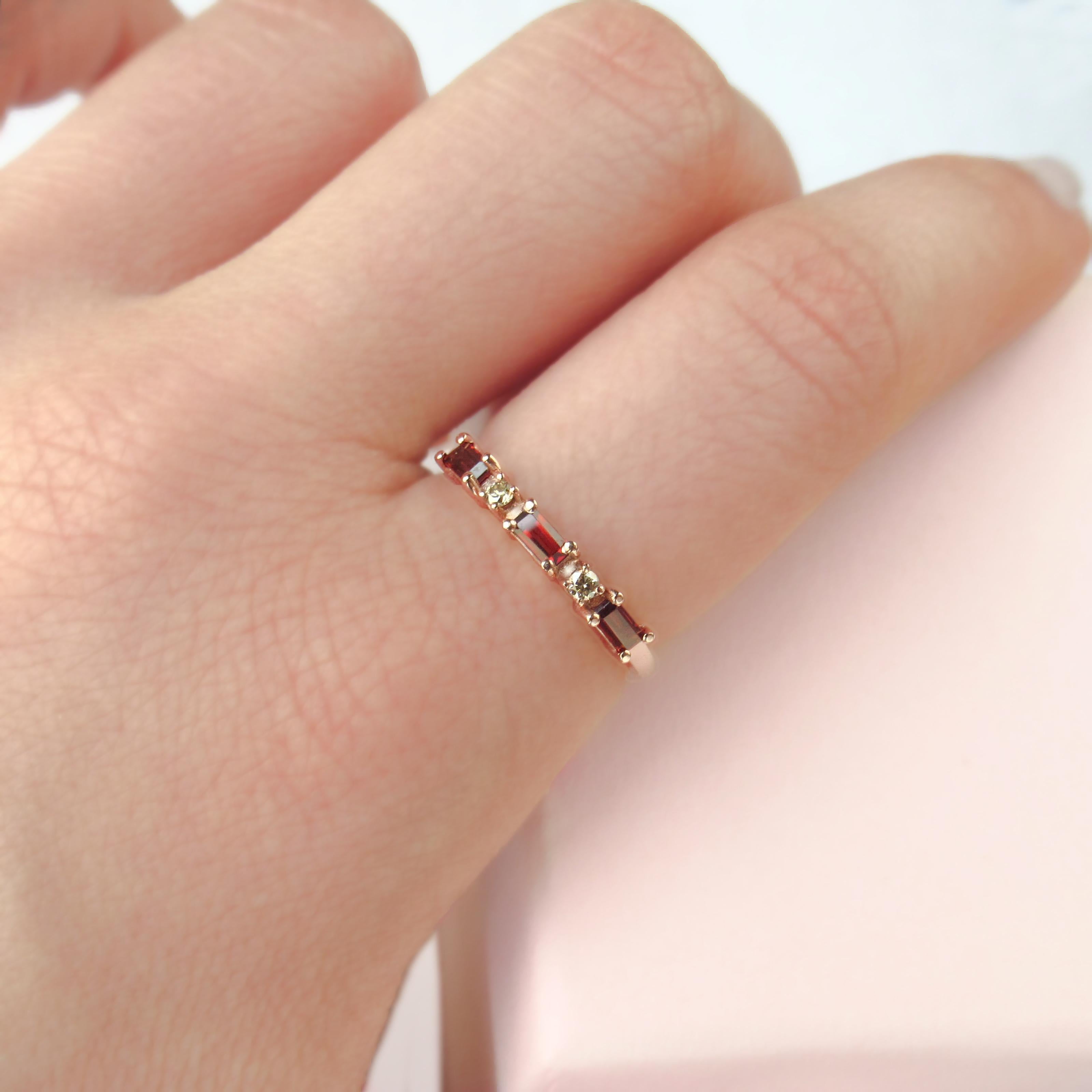 Available in size 7.0 (ready to ship next day) but can be sized upon request, please note that we take 5 business days to modify your jewel before its ready to ship.

This 14 karat rose gold ring has three baguette garnets that have been carefully