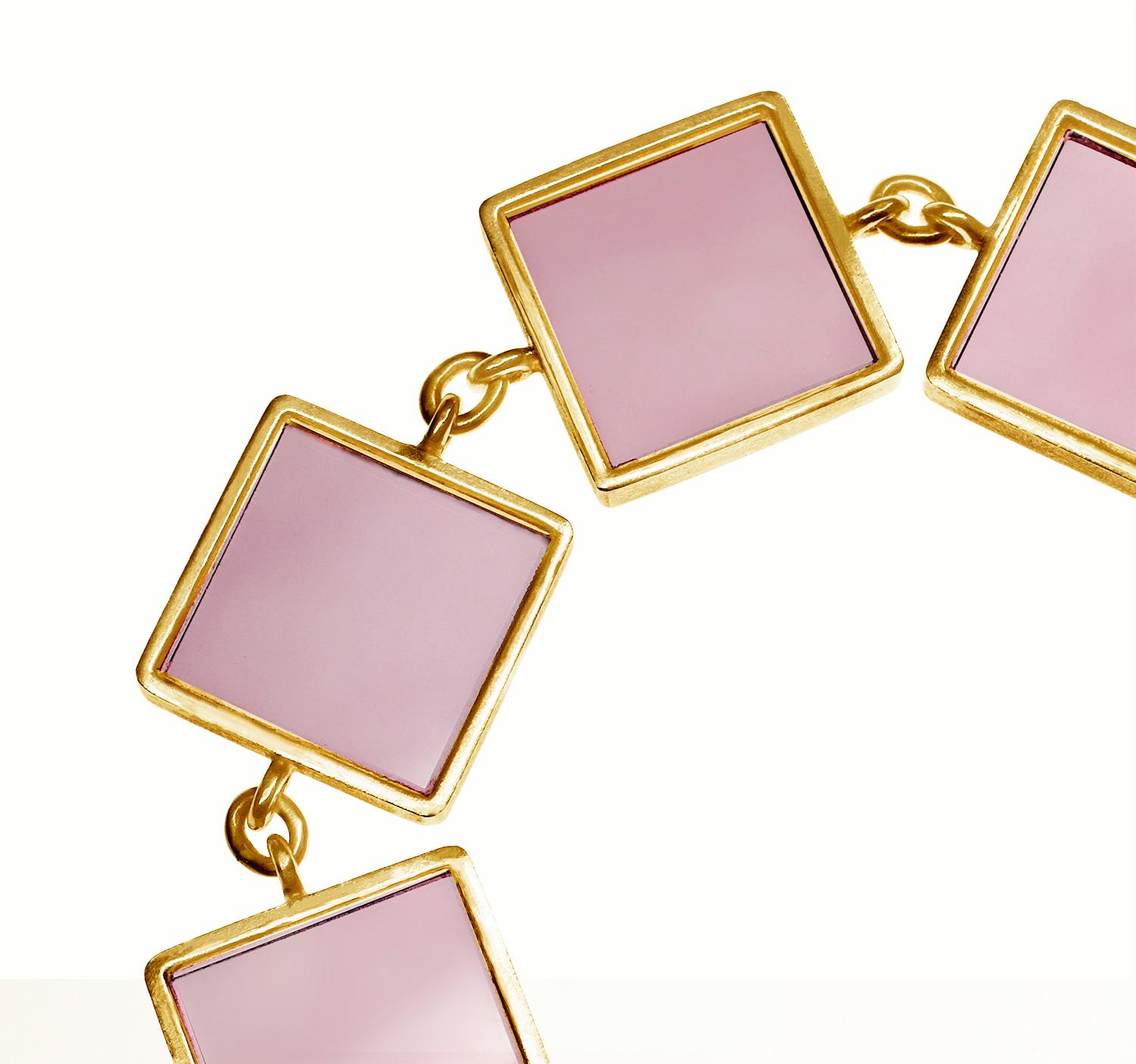This designer jewellery bracelet is in 14 karat rose (or yellow) gold with seven 15x15x3 mm pink onyx. The Ink collection was featured in Harper's Bazaar UA and Vogue UA published issues.

The bracelet shines gently because of the gold and natural