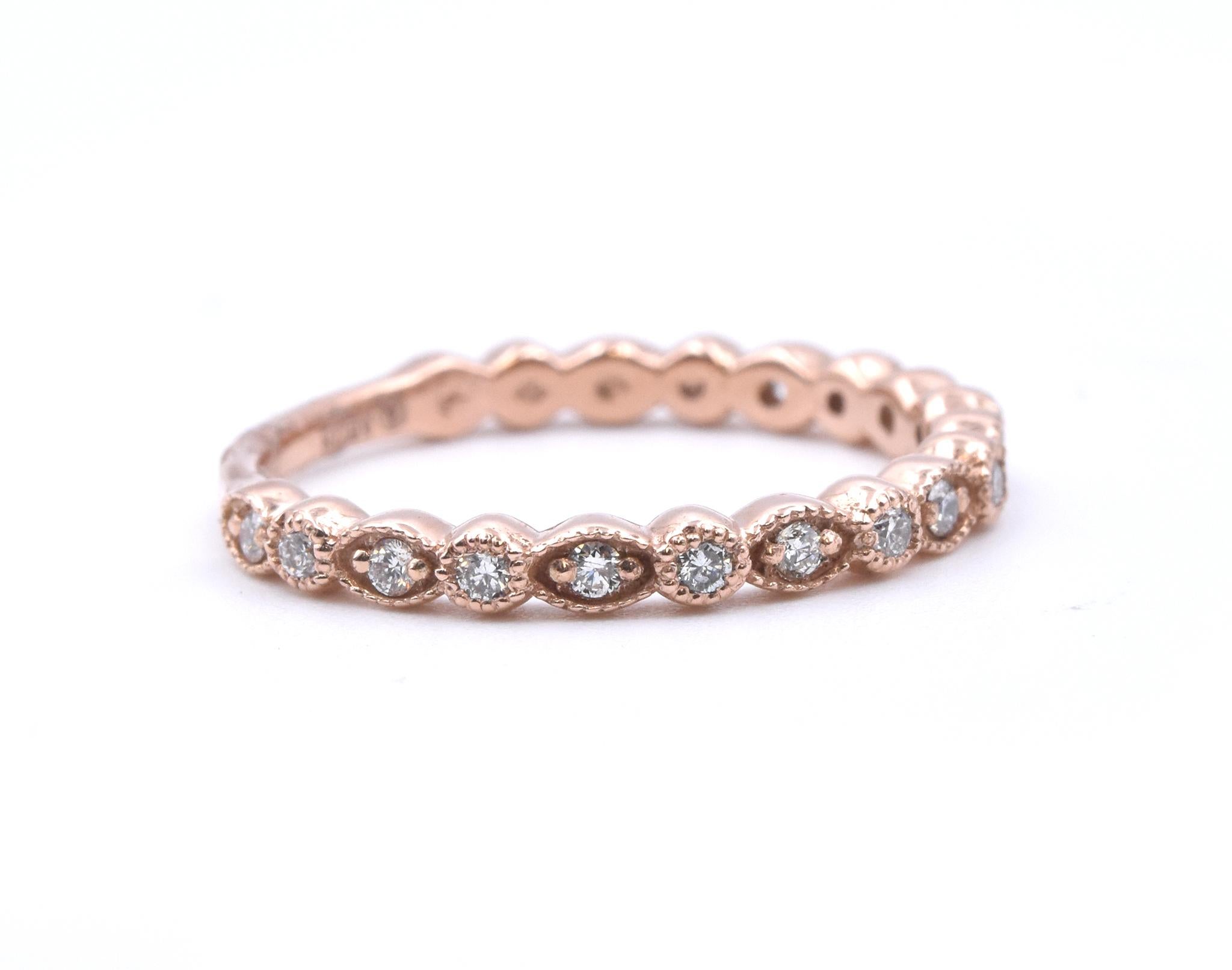 Designer: custom
Material: 14k rose gold
Diamonds: 19 round cut = .23cttw
Color: G
Clarity: VS
Size: 6.75 (please allow two additional shipping days for sizing requests)  
Dimensions: ring measures 2.5mm in width
Weight: 2.11 grams