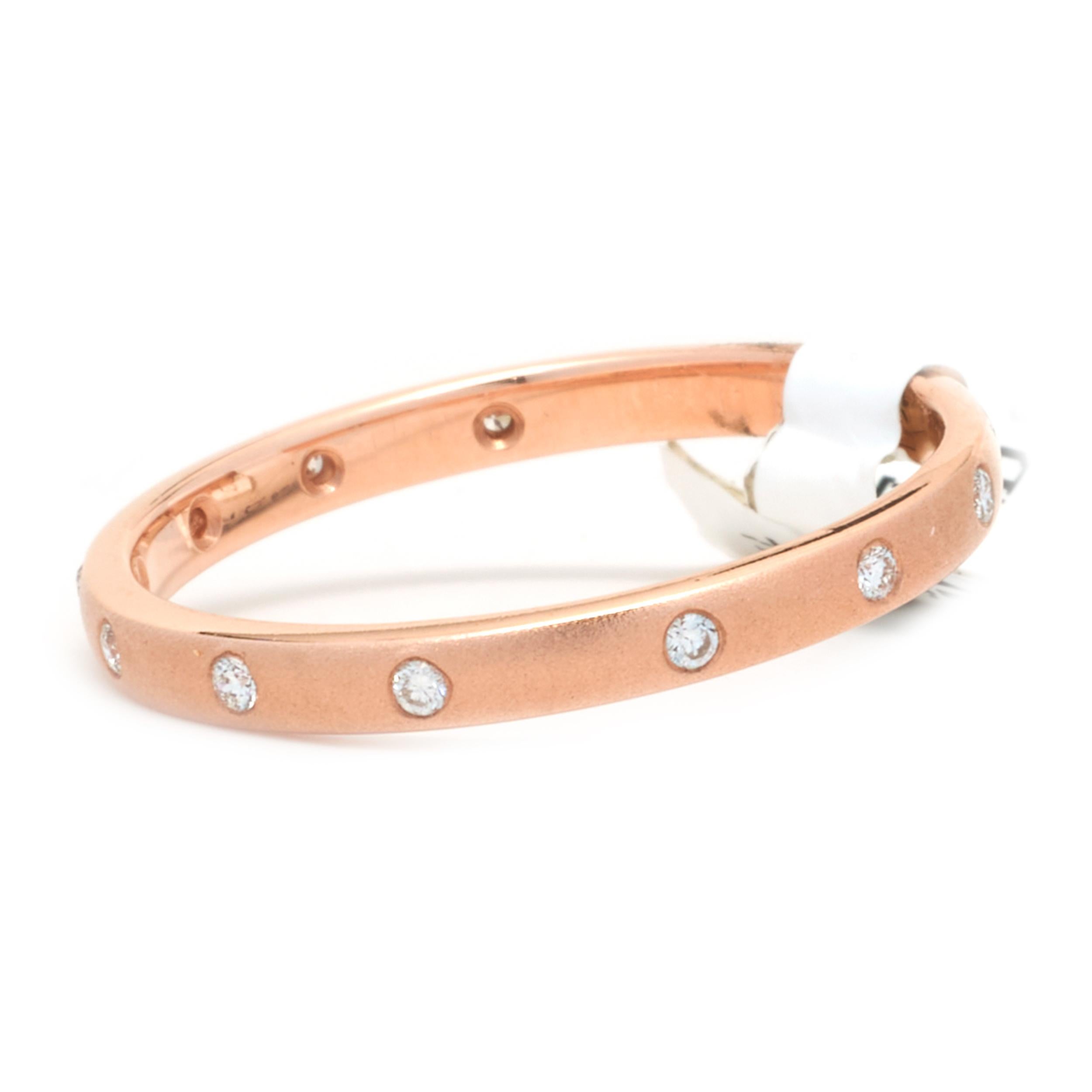 Designer: Custom
Material: 14K rose gold
Diamonds: 10 round cut = .06cttw
Color: G
Clarity: VS1
Size: 6.25
Dimensions: ring measures 2mm in width
Weight: 1.49 grams
