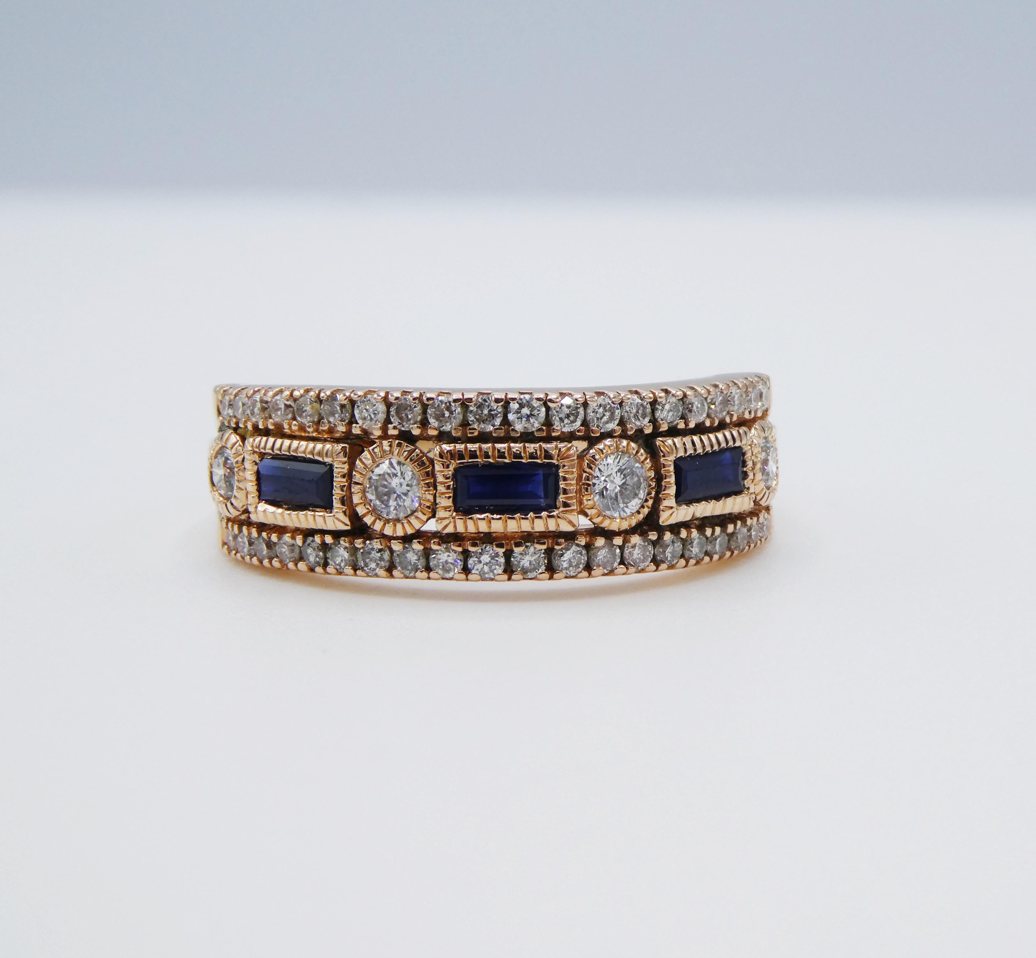 14 Karat Rose Gold Diamond & Blue Sapphire Band Ring Size 8.5 
Metal: 14k rose gold
Weight: 4.10 grams
Diamonds: 44 round brilliant cut diamonds, approx. .50 CTW G VS
Size: 8.5 (US)
Width: 2mm - 7mm
