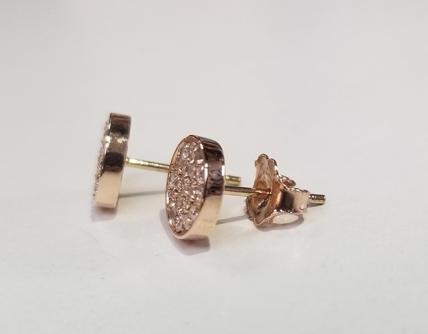 14k rose gold 8mm diamond cluster round earrings pave' set with 35 round full cut diamonds weighing .38pts.