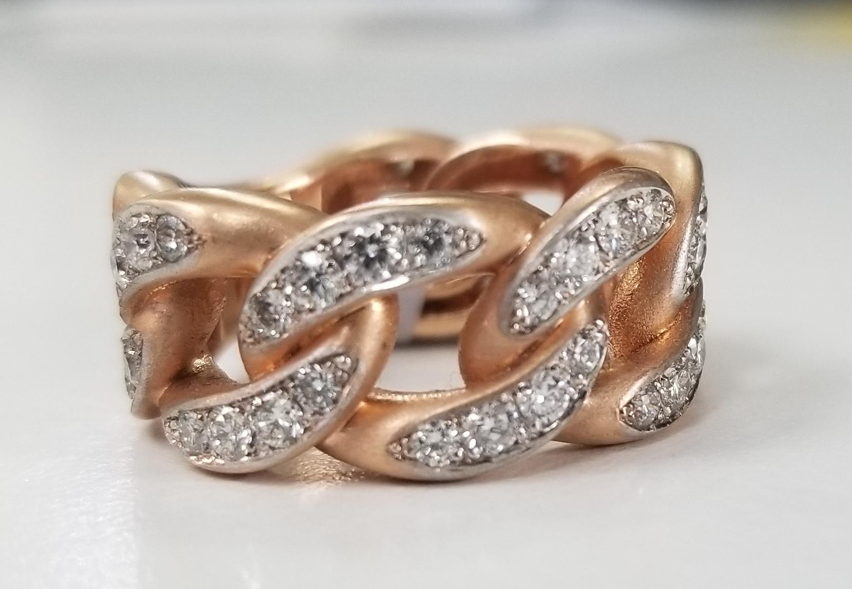 14 karat rose gold diamond pave' link ring, containing 48 round full cut diamonds of very fine quality weighing 1.32cts. ring size is 7 and is 11.5mm wide.