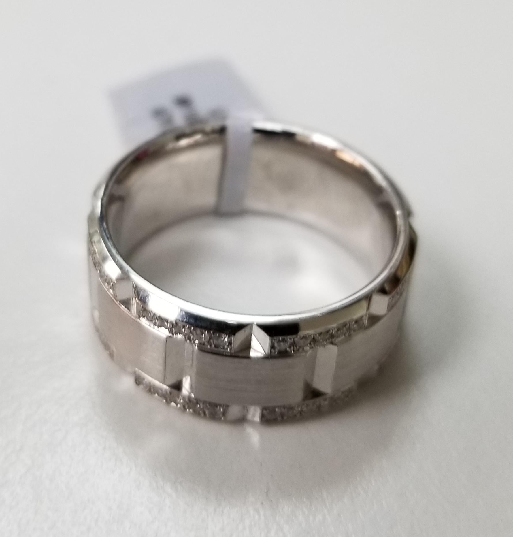 14 karat white gold diamond pave' link ring with matte finish, containing 80 round full cut diamonds of very fine quality weighing .48cts. ring size is 9.5 and is 9.25mm wide. The ring is a eternity ring, meaning diamonds all around.