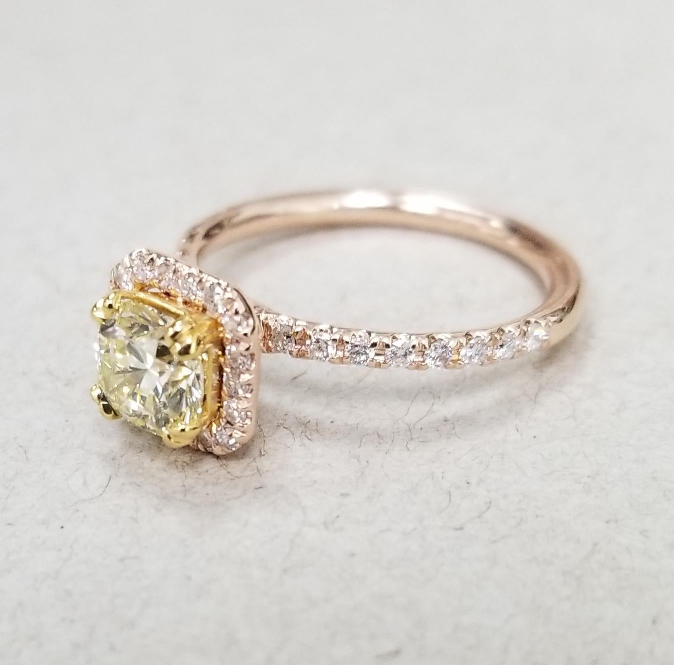 14k rose gold EGL .93pts. natural light yellow and VS1 clarity surrounded by 36 round full cut diamond of nice quality weighing .35pts. set in a halo ring.