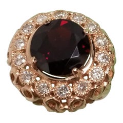 14 Karat Rose Gold Garnet and Diamond Domed Ring