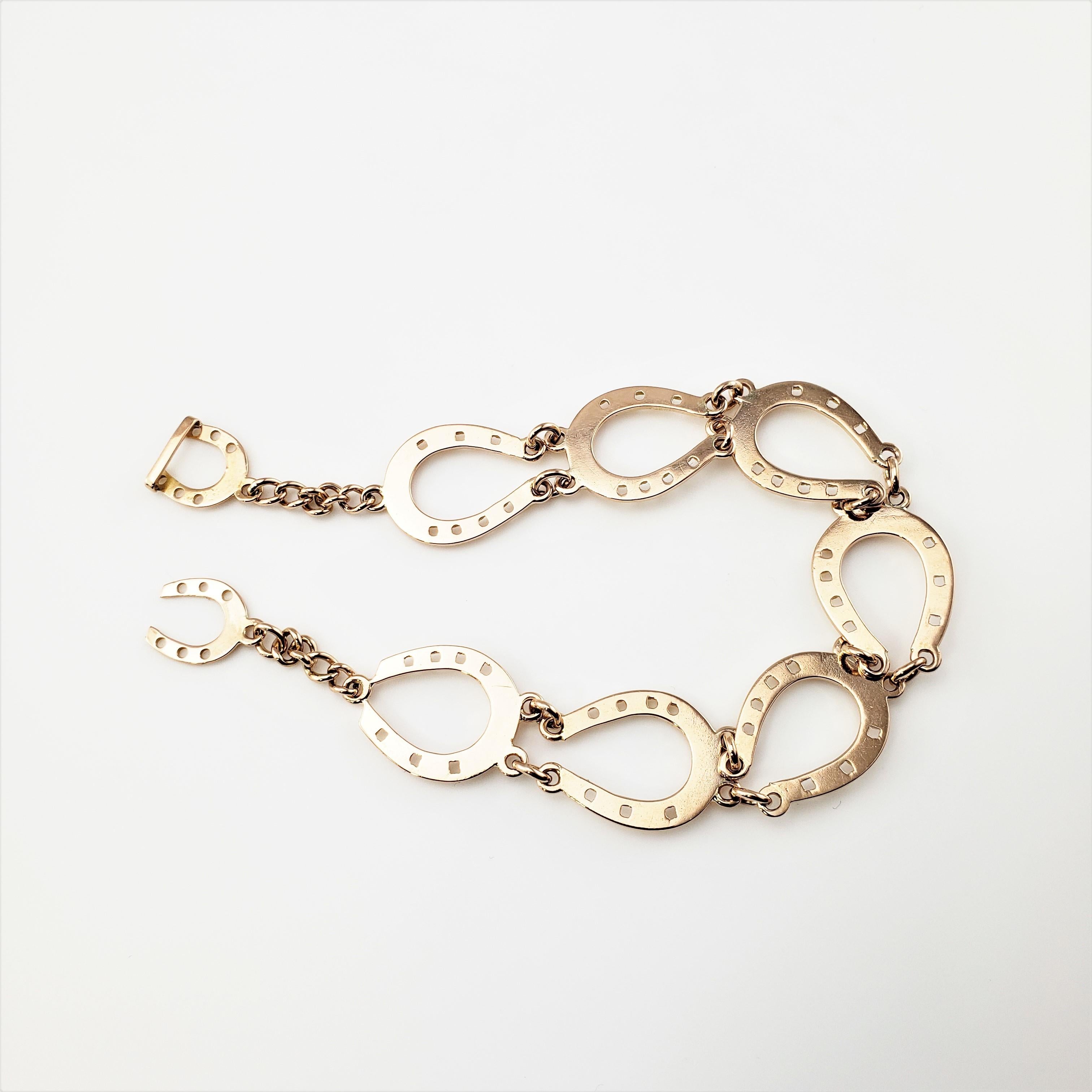 14 Karat Rose Gold Horse Shoe Bracelet-

This stunning horse shoe bracelet features is crafted in beautifully detailed 14K rose gold.  Width:  15 mm.

Size: 7 inches

Weight:  9.8 dwt. /  15.3 gr.

Tested for 14K gold.

Very good condition,