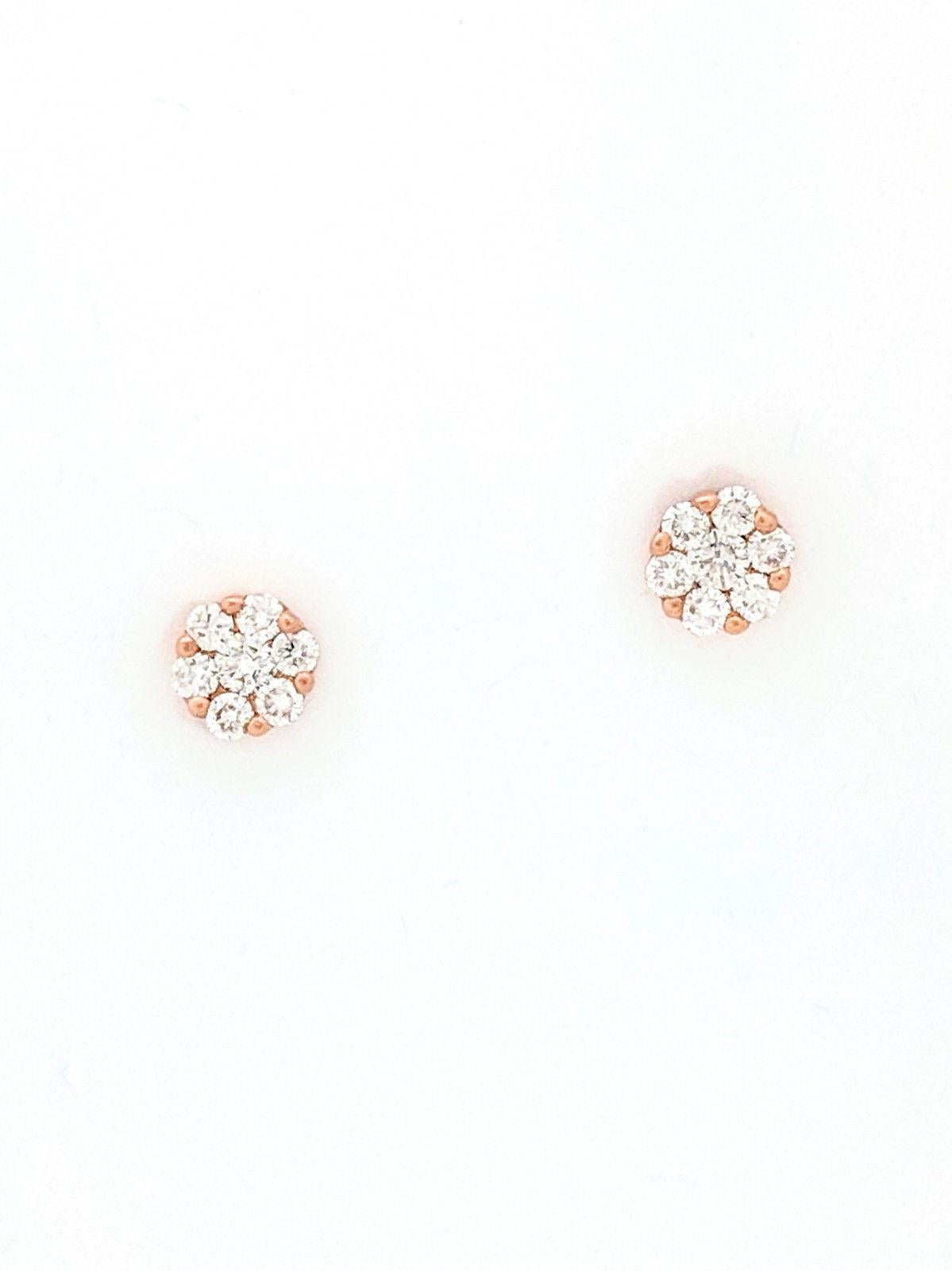 You are viewing a Beautiful Pair of Illusion Set Diamond Stud Earrings. These earrings are crafted from 14k rose gold and weighs .9 grams. Each earring features (1) .07ct natural round brilliant cut diamond placed in the center of (6) .03ct round