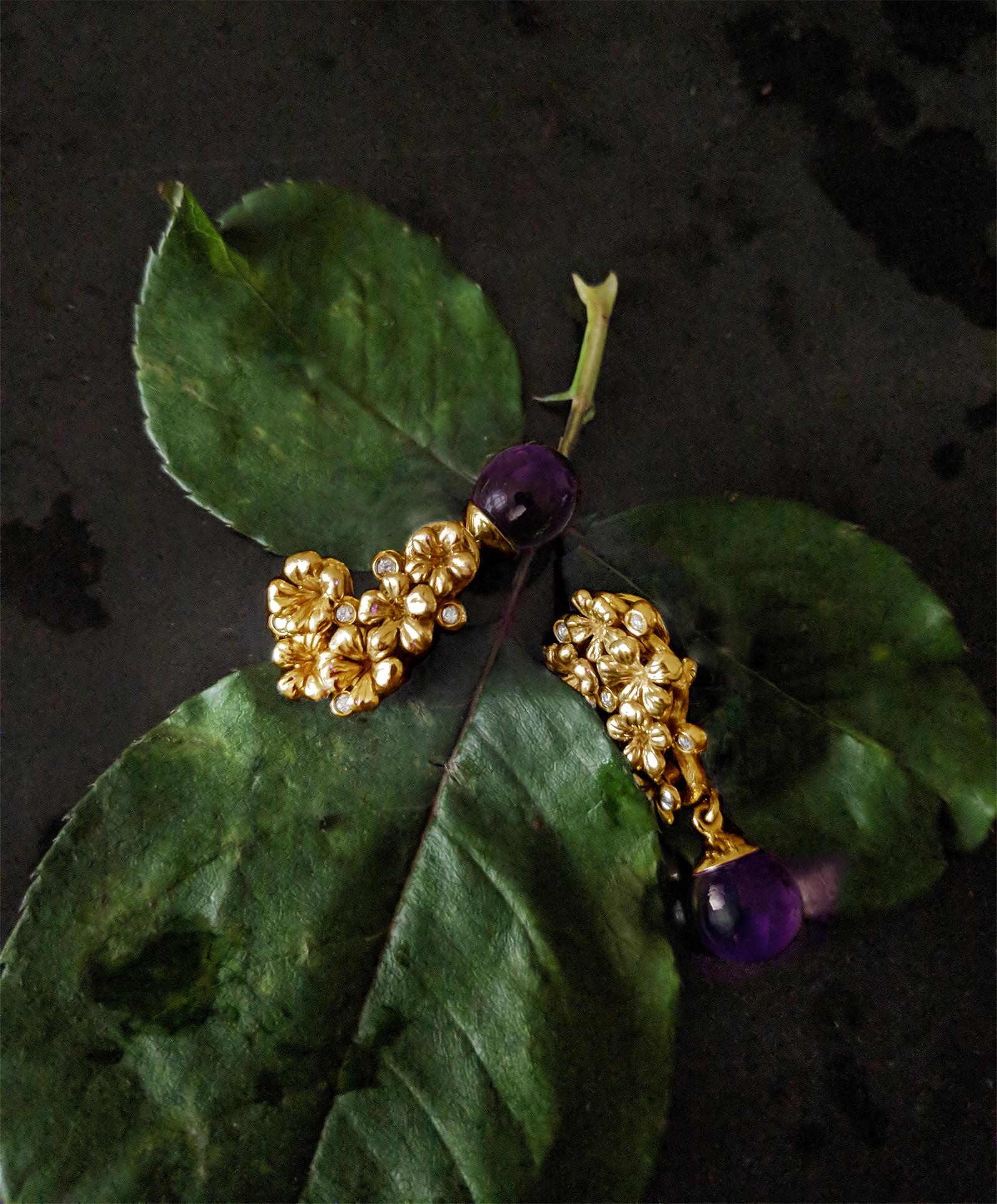 These modern Plum Blossom clip-on earrings with removable cabochon amethyst drops are encrusted with 10 round natural diamonds. The earrings are made of 14 karat rose gold and are part of the collection featured in Vogue UA review. The collection is