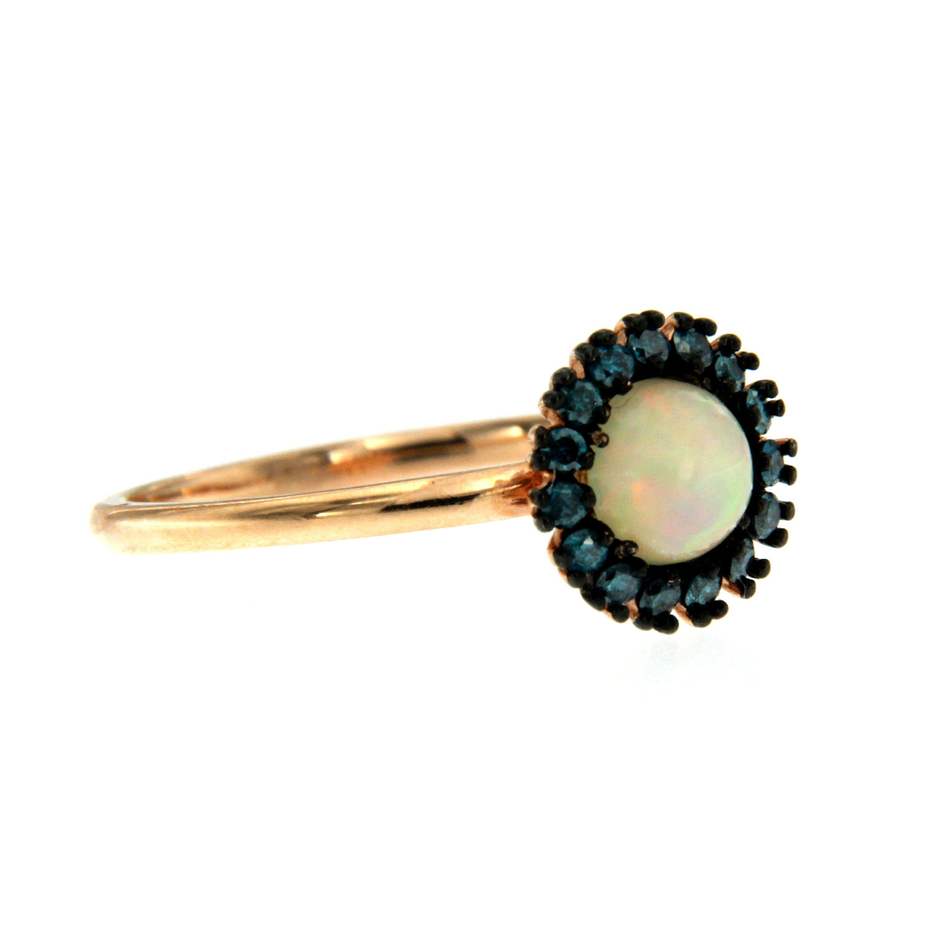 This ring is handmade from 14k gold with a single opal stone surrounded by turquoise colored diamonds. 

CONDITION: brand new 
METAL: 14k rose gold
GEM STONE: Diamond 0.08 total carats 
RING SIZE: US 6 - IT 12 - FR 52 - UK M, Resizable on request,