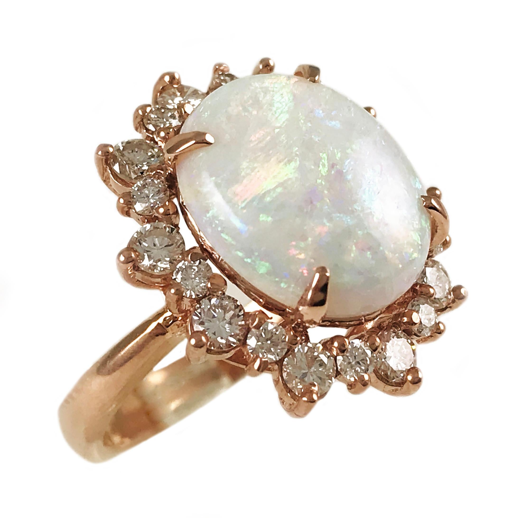 14 Karat Rose Gold natural untreated Opal with Diamond Halo Ring. Opal is 14 x 11.5 x 5mm and has a weight of 2.95ct. The intense beautiful greens and pinks in the play of color is exquisite. The diamond halo consists of twenty single-cut diamonds,