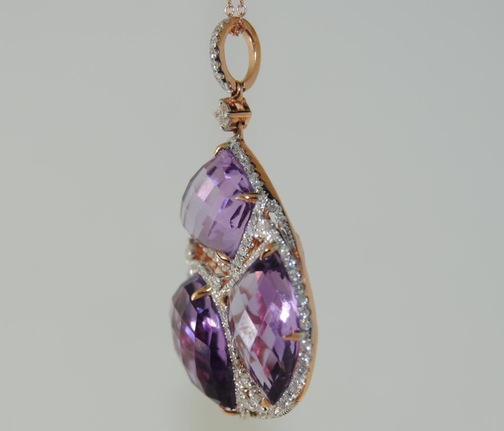This unmatched 14-karat Rose Gold Pendant has 3 Mix Shape Amethyst that weighs 15.02 carats and 118 White Round Diamonds that weighs .98 carats.
