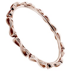 Bracelet jonc enveloppant infini en or rose 24 carats et vermeil