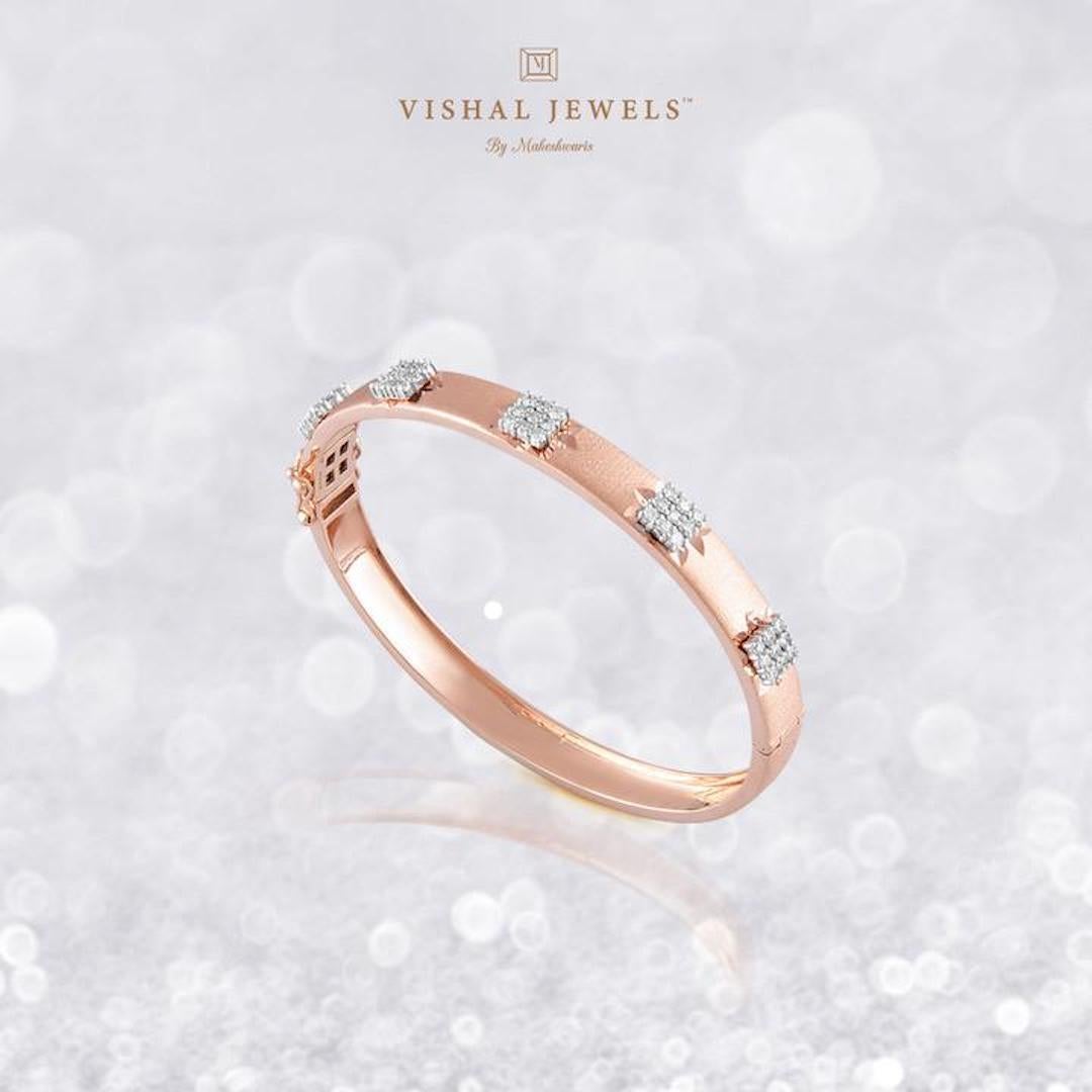 Diamond: 0.75 carats
Gold: 13.810 grams 14k 
Colour: HI
Clarity: SI 

Rose gold glimmer with scintillating and starry diamonds just rightly put together to bring you a tasteful and elegant piece of jewelry which is unique yet classic 