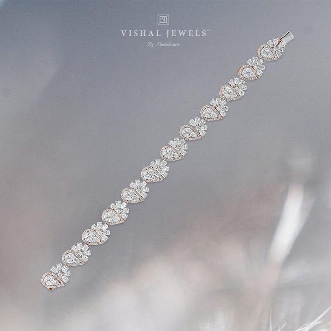 Diamond: 10.62 carats 
Gold: 18.776 grams 14 k 

Always have a dazzling surprise up your sleeve with this stunning fancy shaped diamond tennis bracelet 
