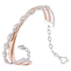 Bracelet jonc en or rose 14 carats et or blanc avec diamants blancs