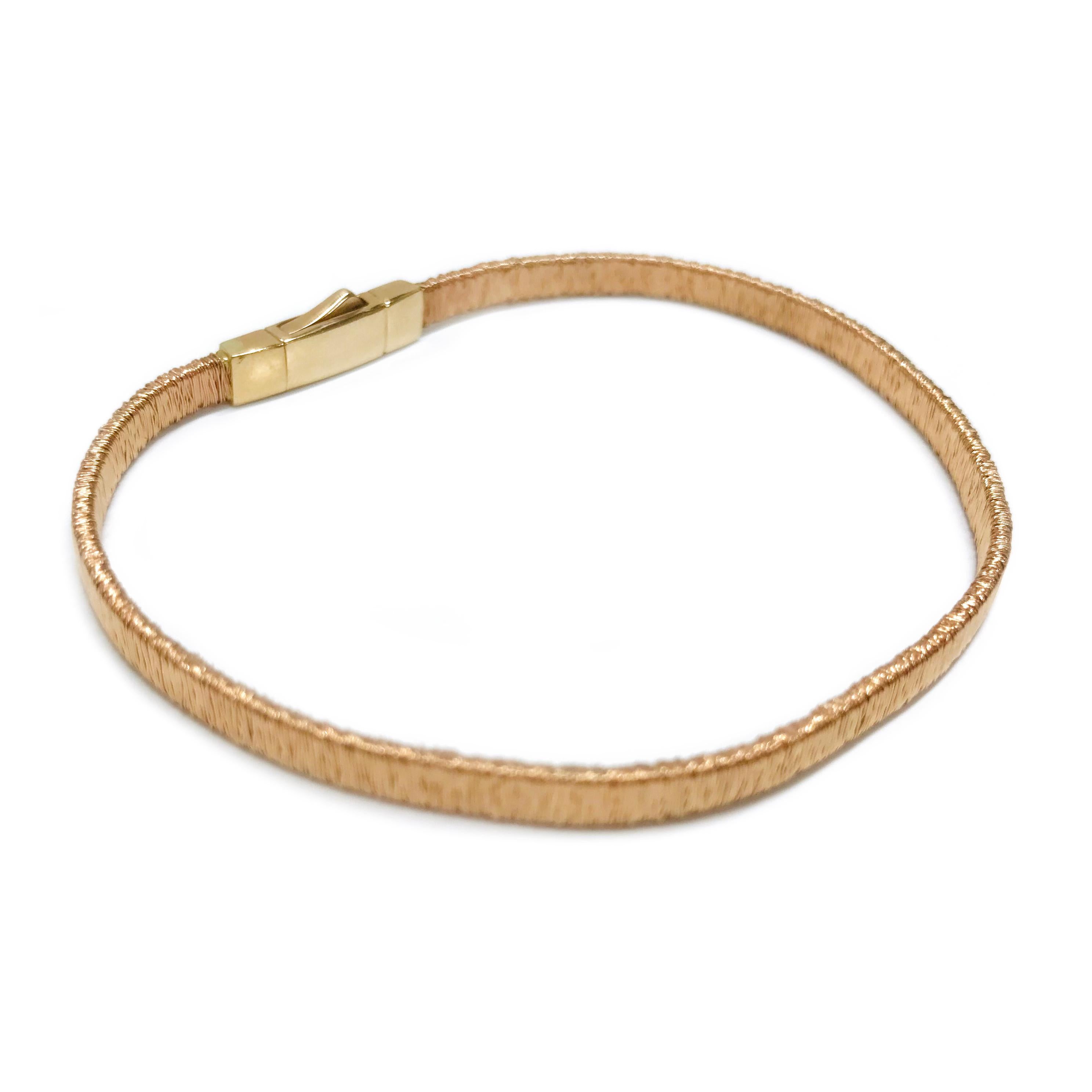 14 Karat Rose Gold Wire Bracelet. The weight light bracelet features rose gold wire wrapped all along the bracelet. The width of the bracelet is 3.75mm and it's 7 1/2