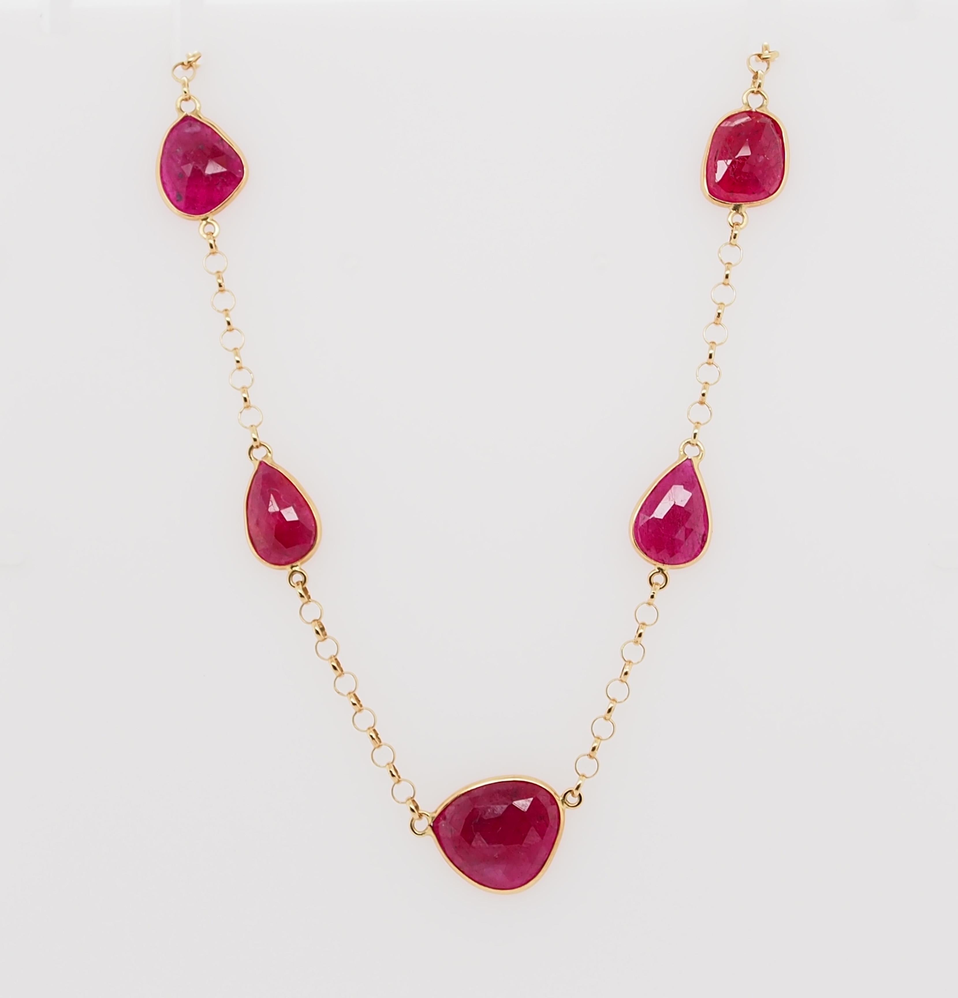 Seven beautiful Rose Cut Rubies are bezel set with approximately 1 inch of chain between.  12 carat total weight.  14K yellow gold,  16