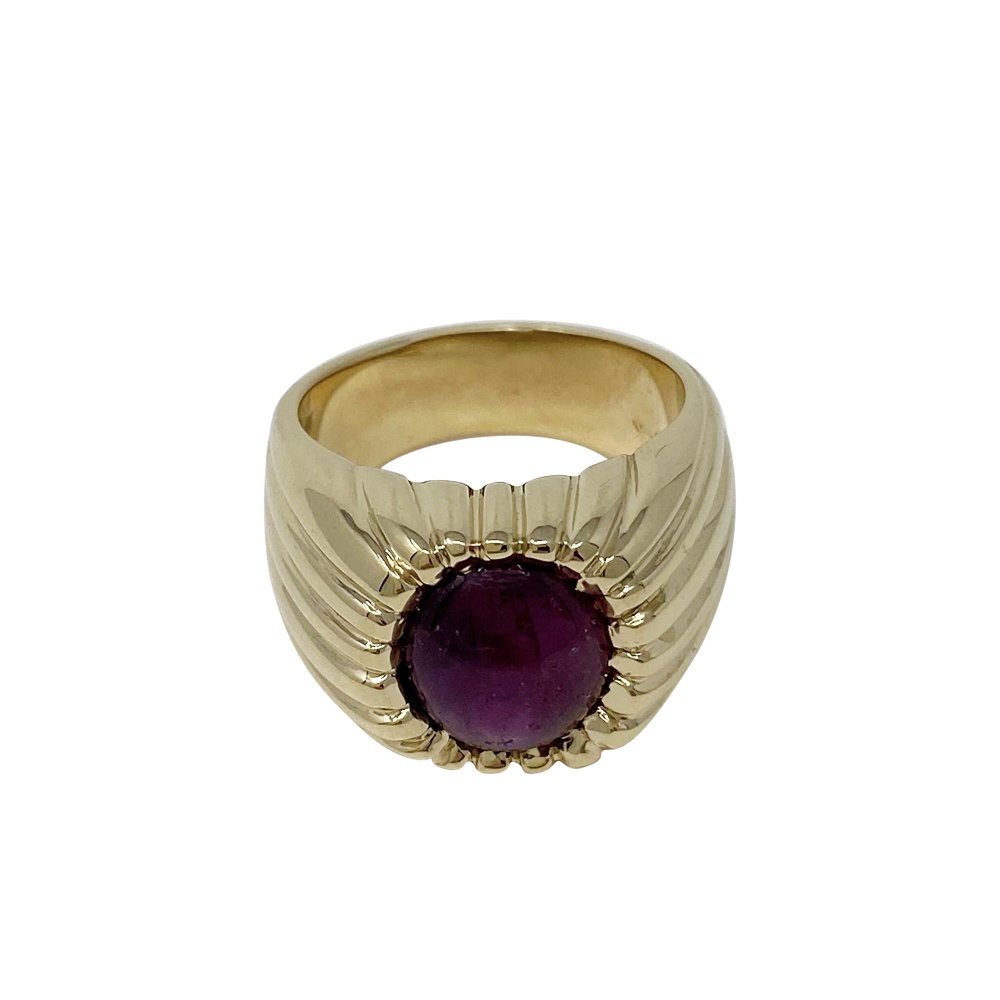 This 14 karat yellow gold, ridged mounting is the perfect compliment to the oval-shaped, cabochon-cut 5.00 carat ruby!  Size 6