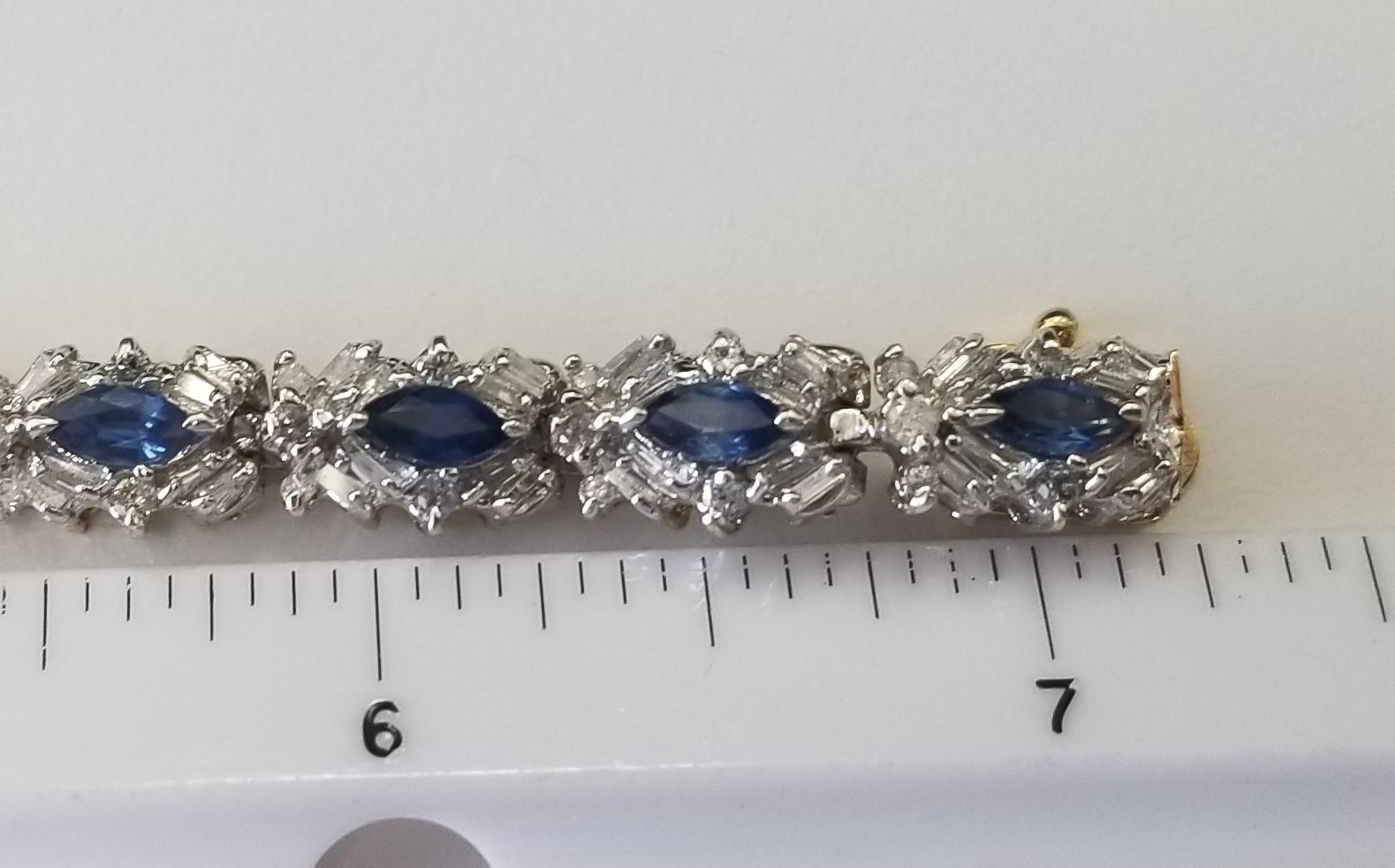 14 karat Sapphire and diamond bracelet 8.75ct. total weight, containing 15 marquise cut sapphires weighing 2.50cts., 120 baguette cut diamonds weighing 4.00cts. and 75 round diamonds weighing 2.25pts. all weights are estimates.