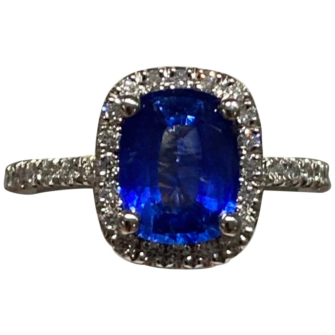 14 Karat Sapphire and Diamond Halo Ring For Sale