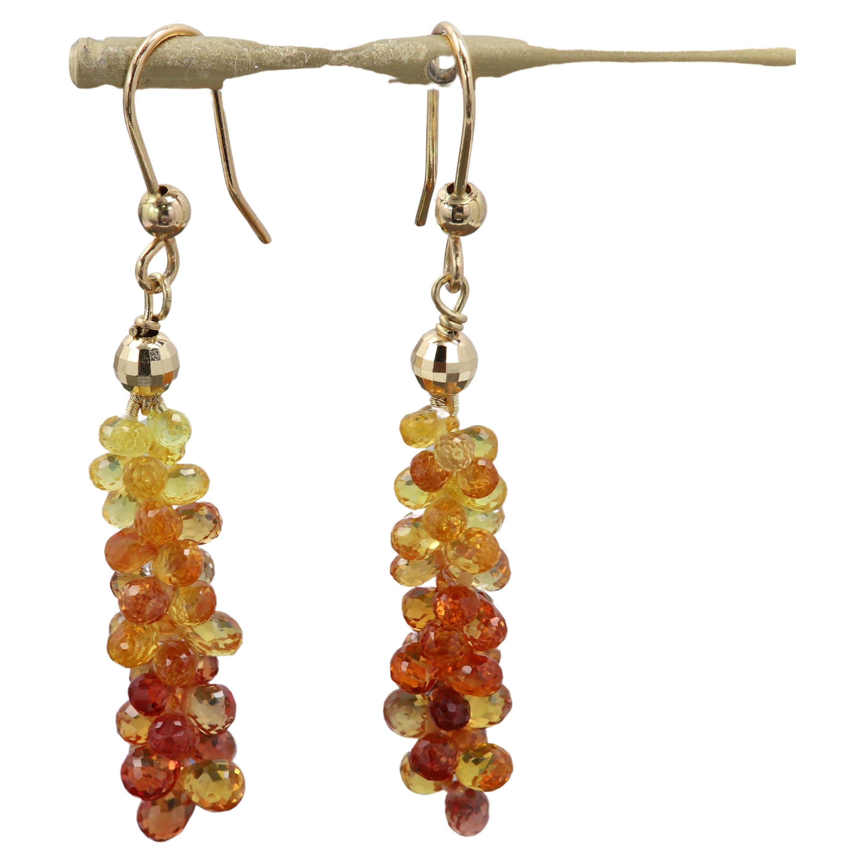 Made in USA
Unique Tear Drop/Briolette Sapphire Earrings
Naturals Gemstones
Orange and Yellow 
Trendy and fashionable look.
weight is approx 4.0 grams total.
Real 14k Yellow Gold - hook wire and balls.
Approx total size: 2' Inch long 
Sapphire drops