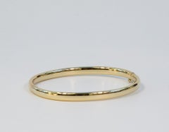 Bracciale rigido con bracciale a cerniera in oro giallo massiccio 14 carati