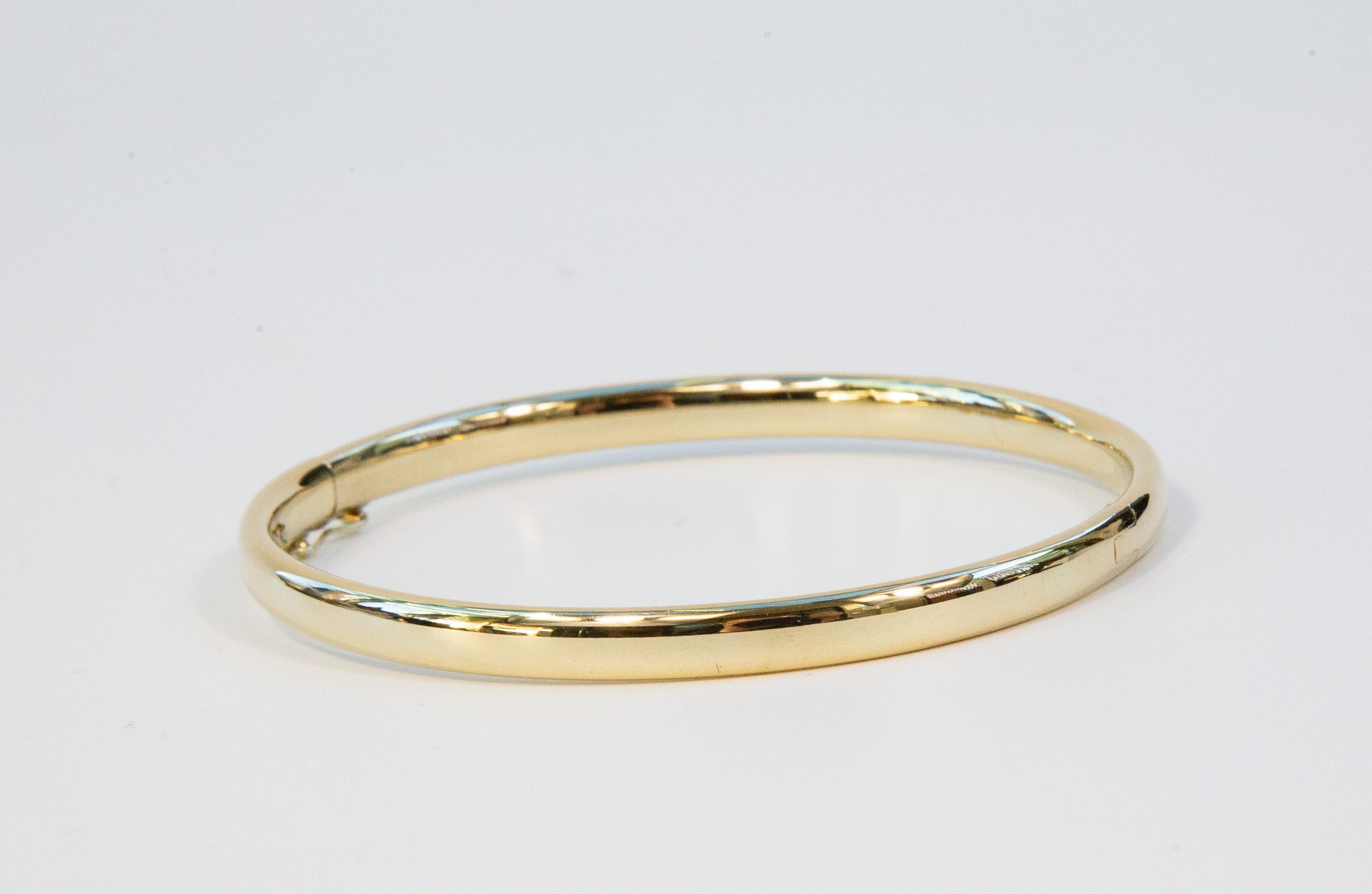 14 Karat Solid Yellow Gold Hinged Bangle Rigid Bracelet en Excelente estado para la venta en Arnhem, NL