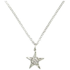14 Karat Star Shape Pendant Has Round Cut Diamond with 5 Tapered Baguettes