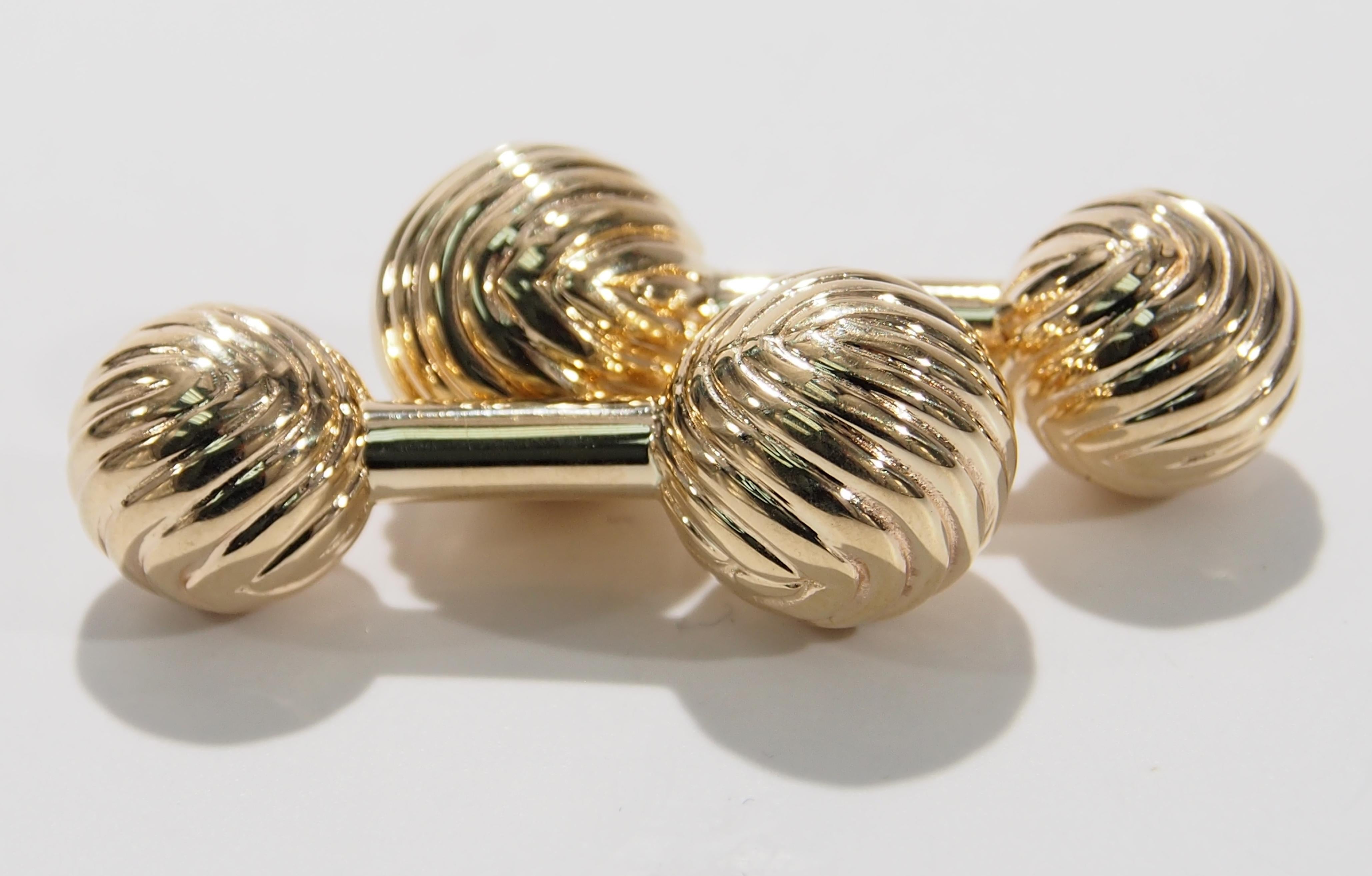 From the iconic jewelry designer, Tiffany & Company are this 14K Yellow Gold Cuff Links. They are designed with a classic spiral texture and are 1 1/4 inches in length, 1/4 inch in width. Tiffany & Co Cuff Links make a wonderful gift for a special