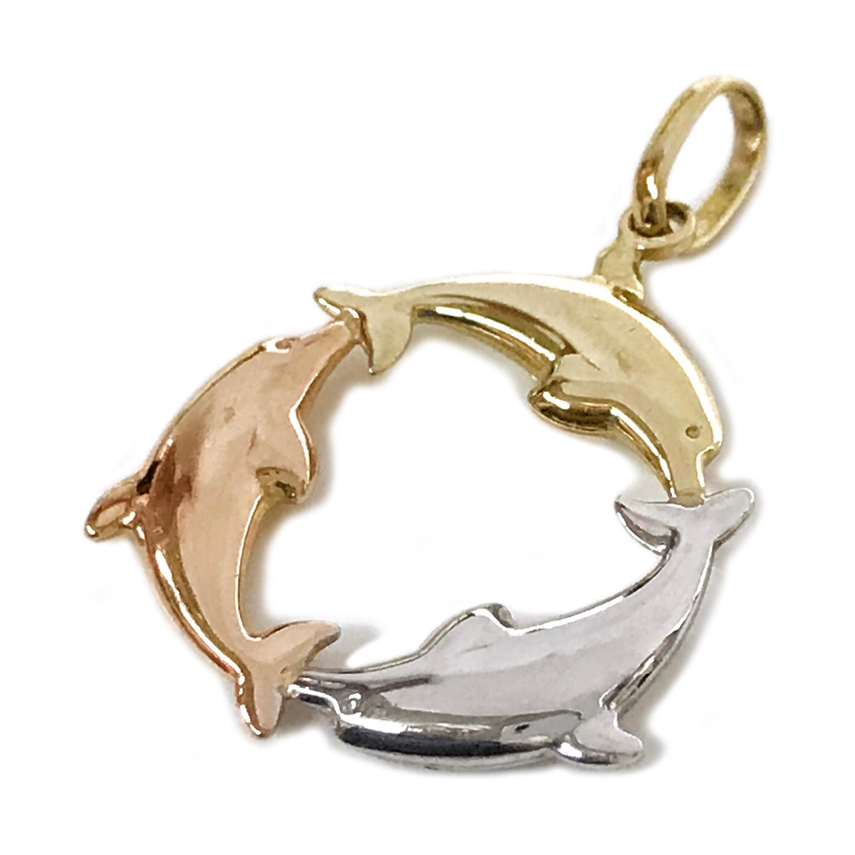 14 Karat Tri-Gold Dolphin Pendant. The pendant features a yellow gold, white gold, and rose gold dolphin connected to create a circle. The pendant measures 20mm tall x 19.25mm wide. Stamped on the back is AU 14K TURKEY. The total gold weight of the